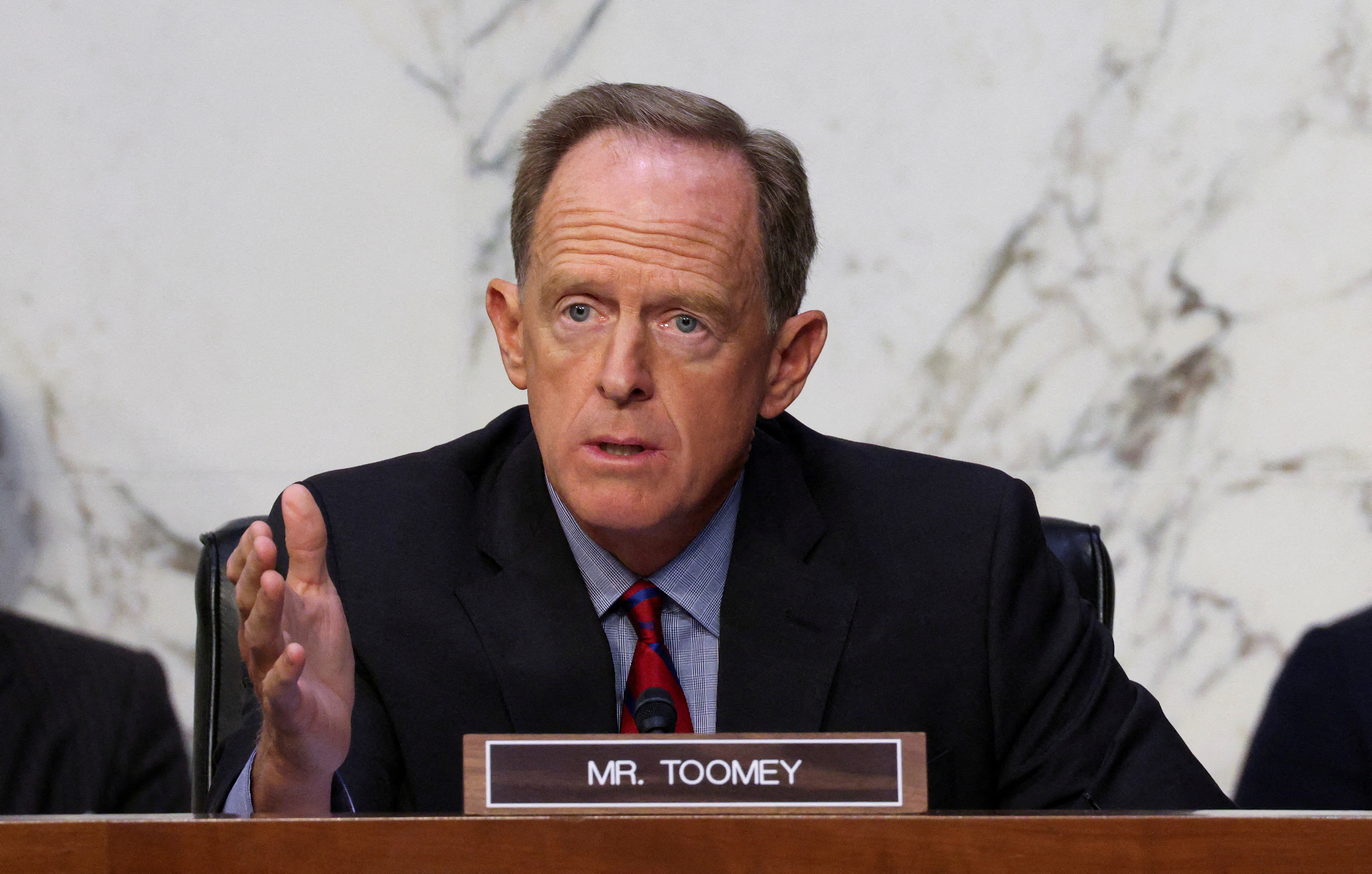 Sen. Pat Toomey questions Treasury Secretary Janet Yellen and Federal Reserve Chair Jerome Powell during a Senate Banking committee hearing in Washington