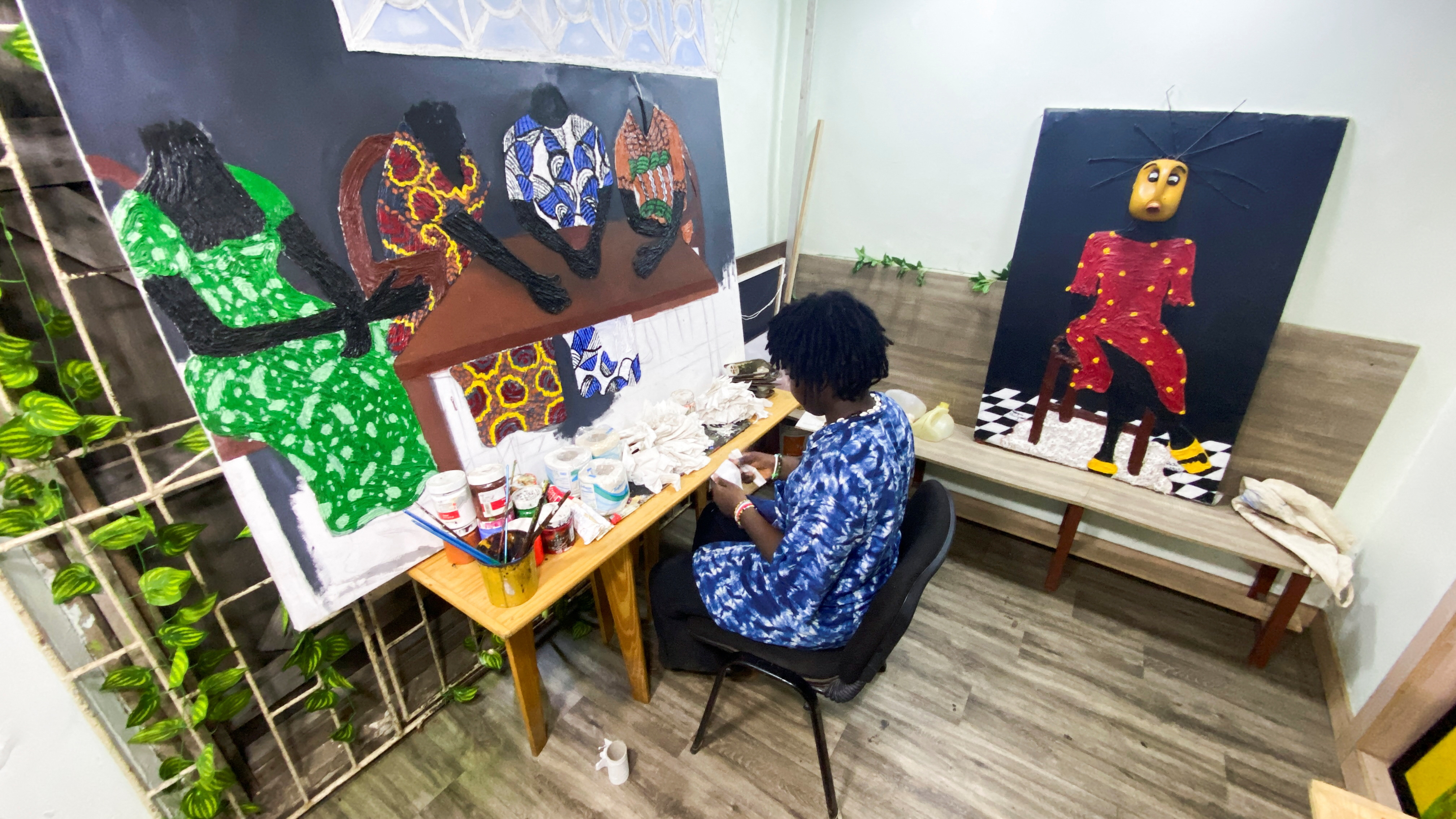 Nigerian artist, Adeyemi Oluwajuwonlo sorts recycled materials to produce artworks at her studio in Lagos