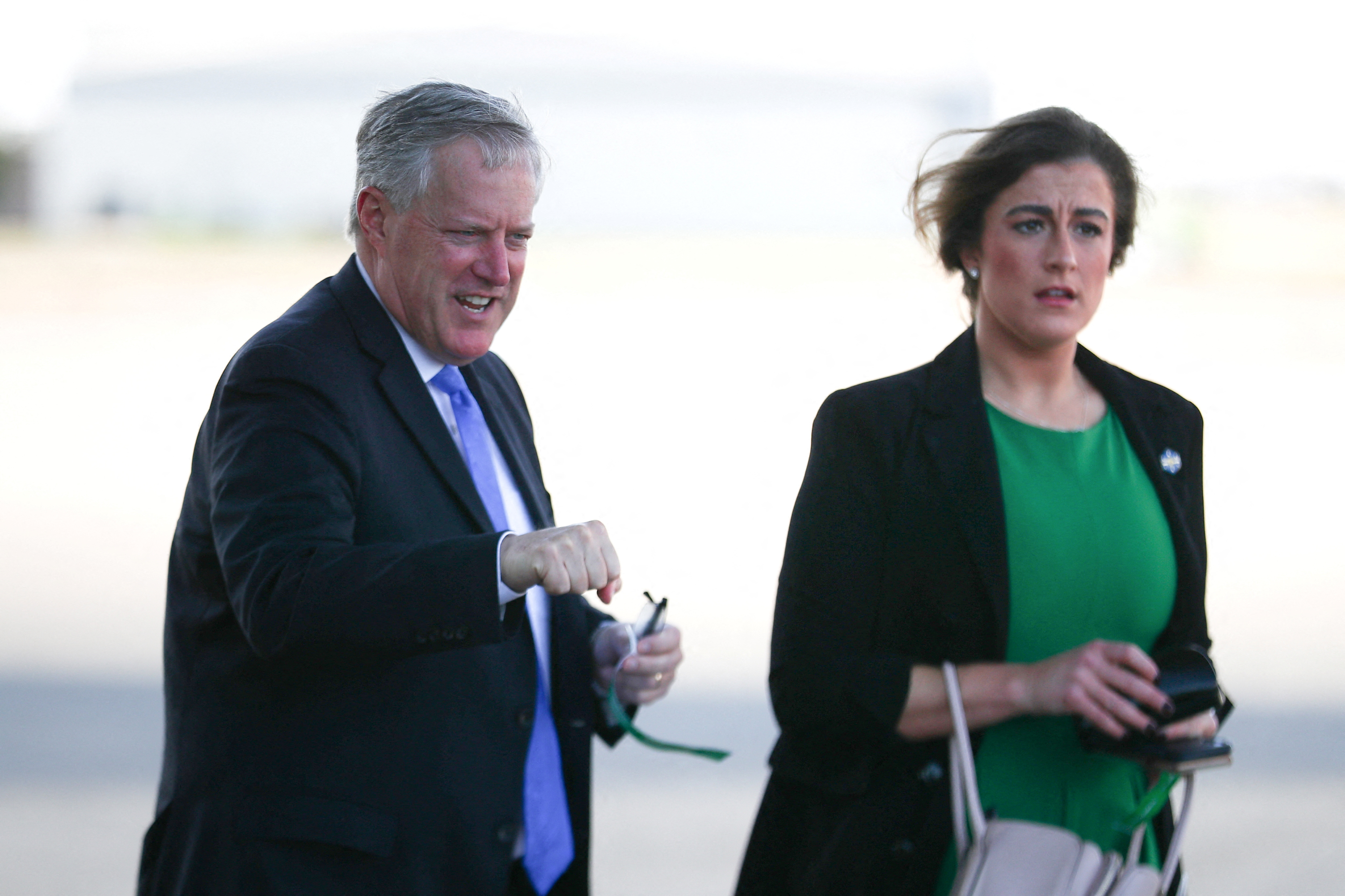 White House Chief of Staff Mark Meadows, left, walks with senior aide Cassidy Hutchinson before a campaign rally in Gastonia