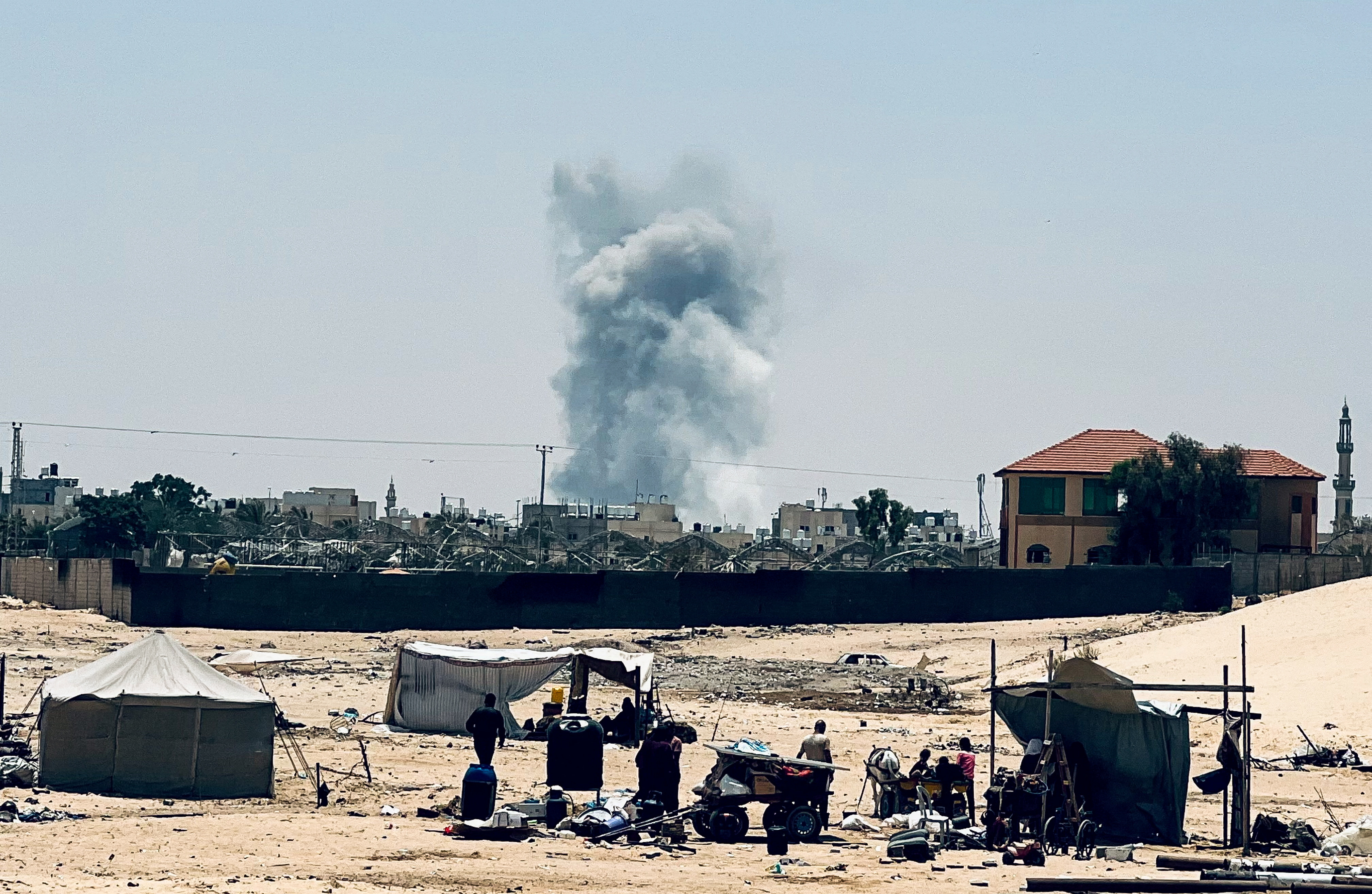 Smoke rises following Israeli strikes, in Rafah