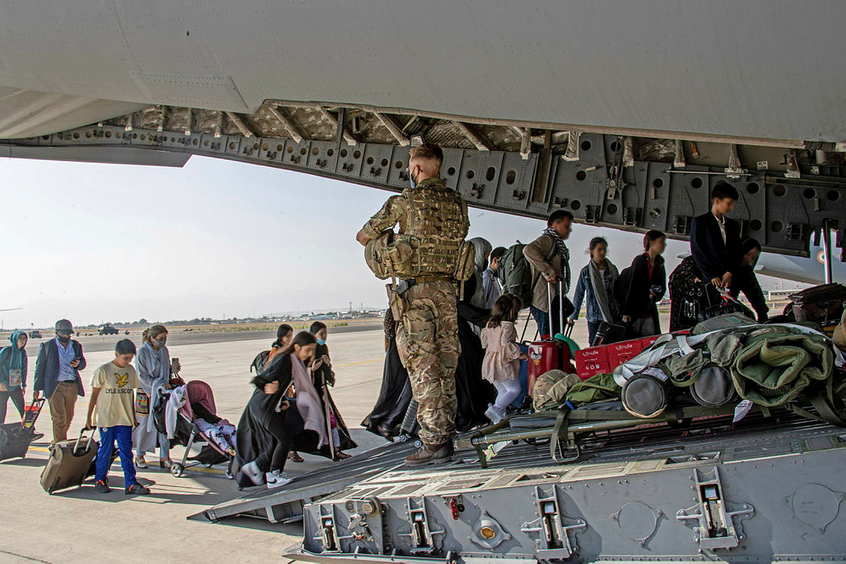 British citizens and dual nationals residing in Afghanistan board a military plane for evacuation from Kabul airport
