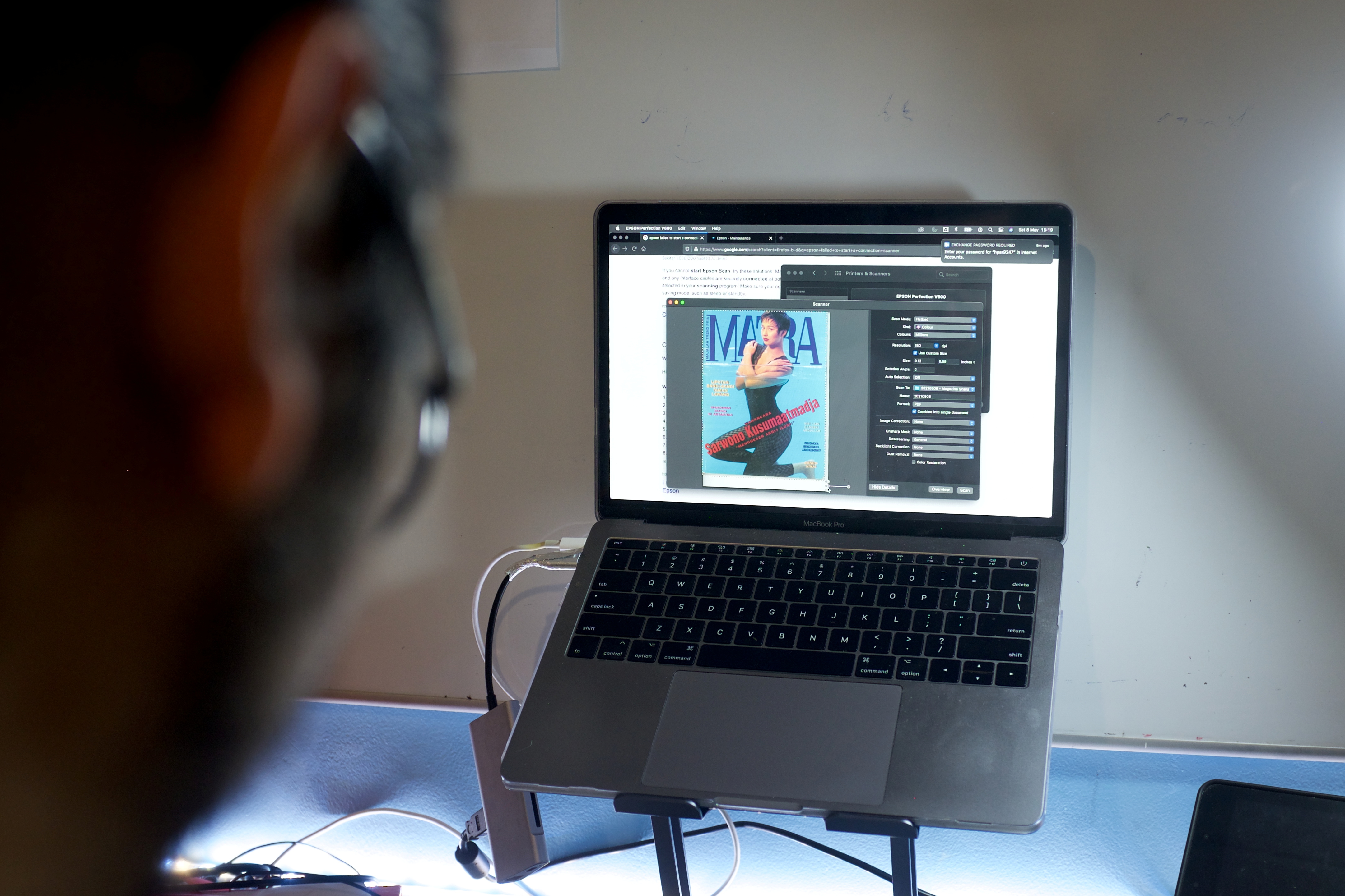 The cover of an old Indonesian LGBT+ magazine is seen on a screen while being digitised by Ais, a 29-year-old LGBT+ researcher, in Jakarta, Indonesia