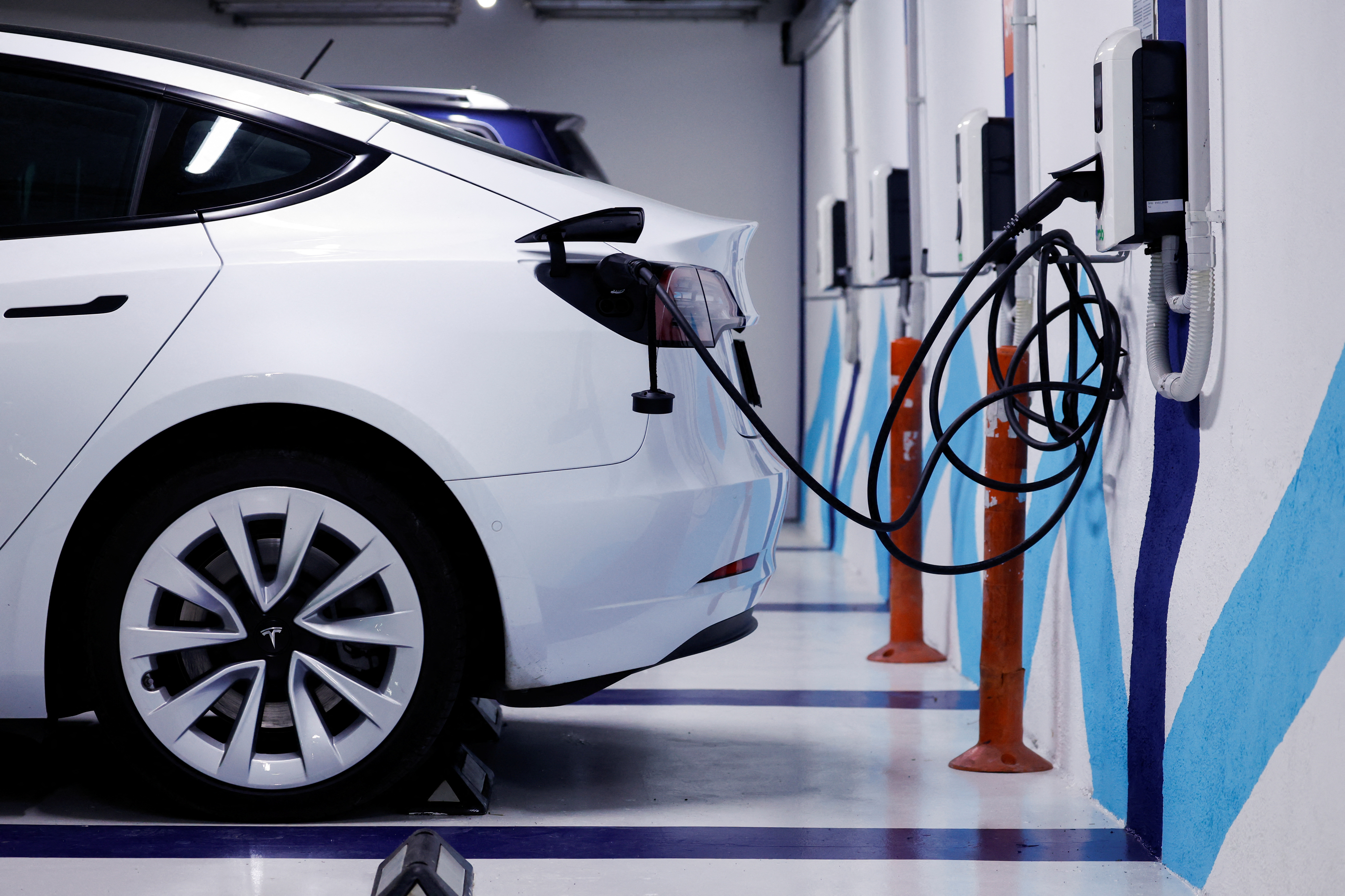 An electric vehicle is plugged into a charging station in Bilbao