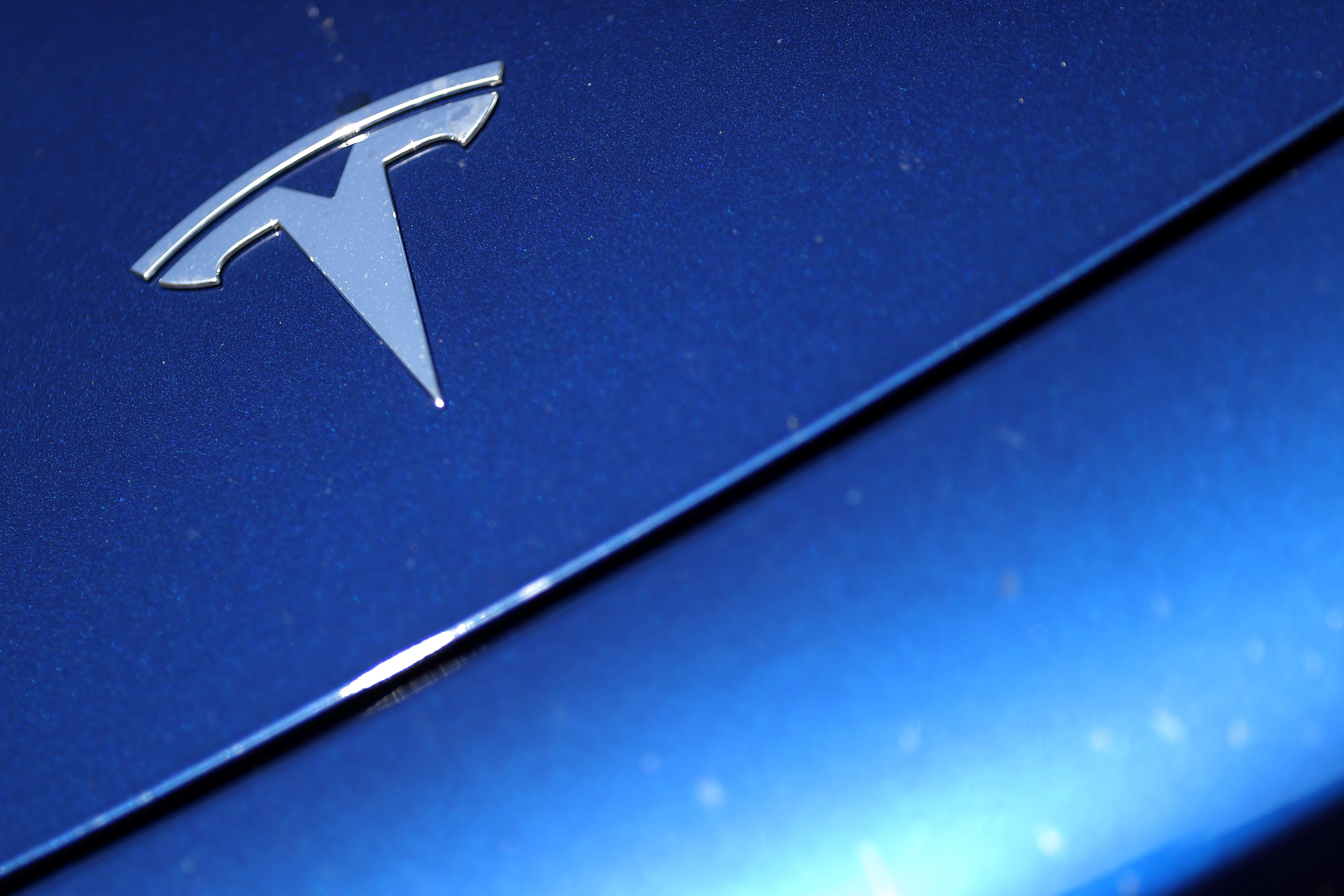 The Tesla logo is seen on a car in Los Angeles, California, U.S., July 9, 2020.  REUTERS/Lucy Nicholson