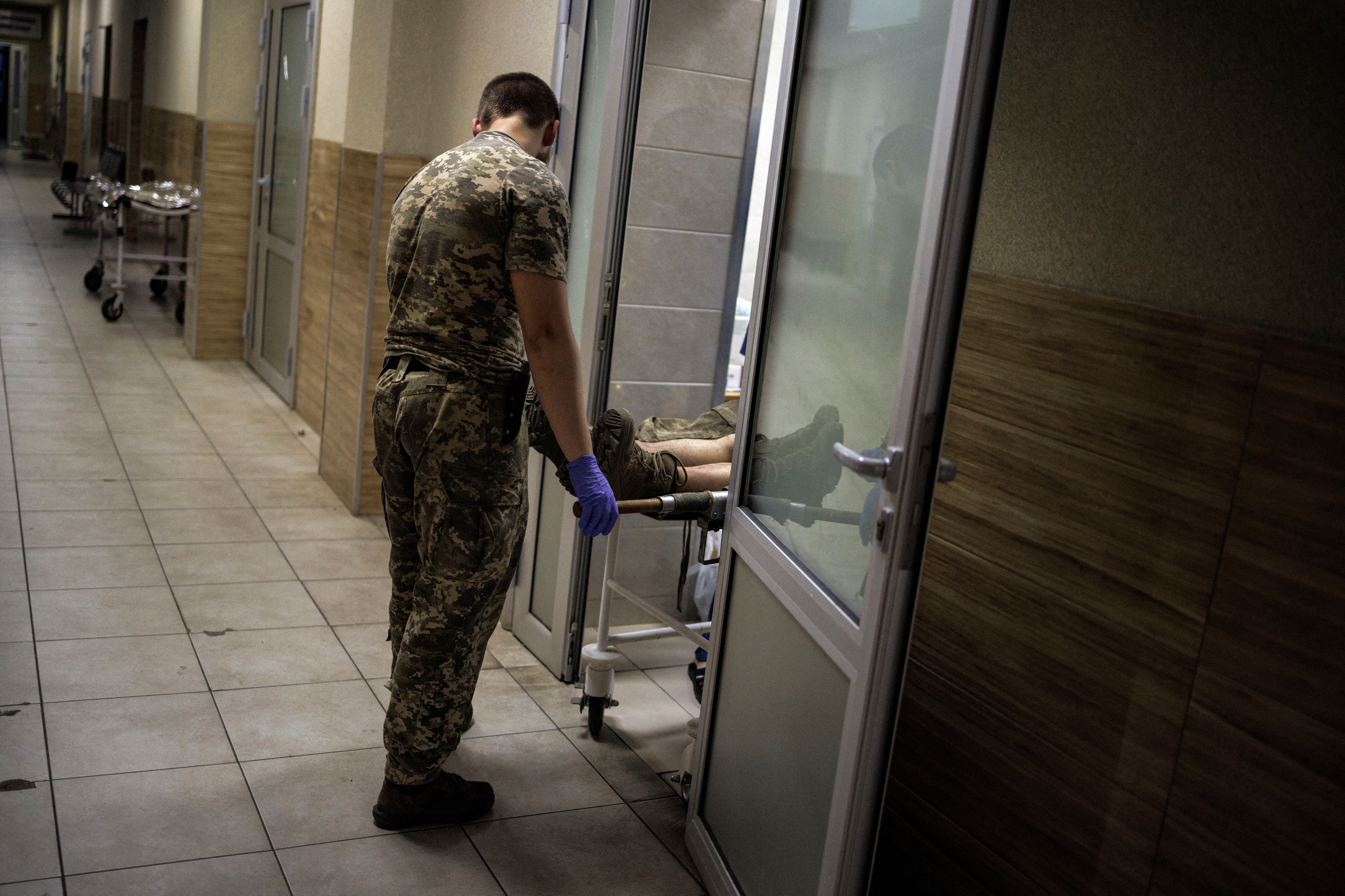 Doctors treat wounded soldiers at a frontline military hospital in Donetsk region, as Russia's attack on Ukraine continues
