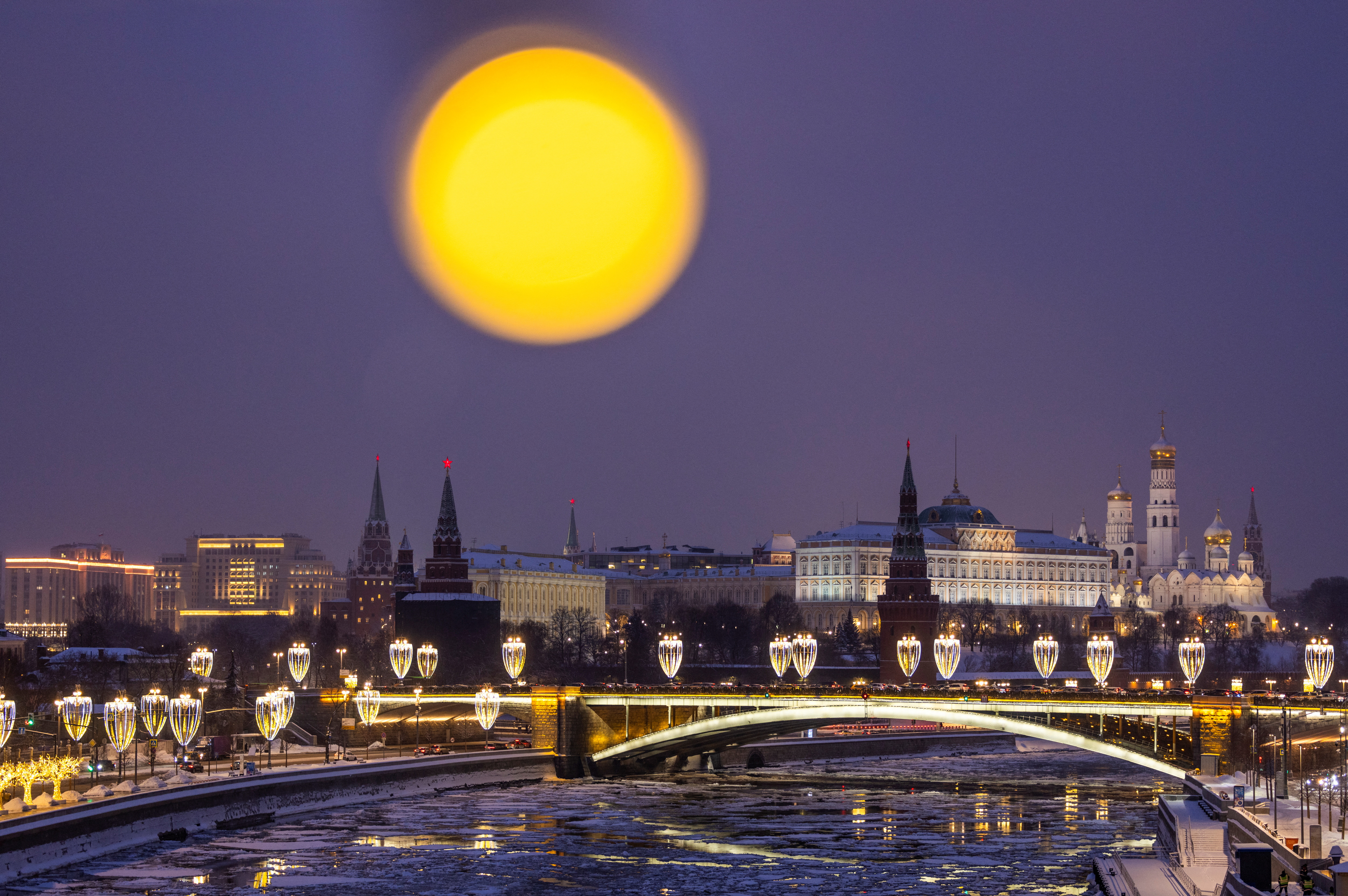 The Kremlin is seen next to the partially frozen Moskva river in Moscow