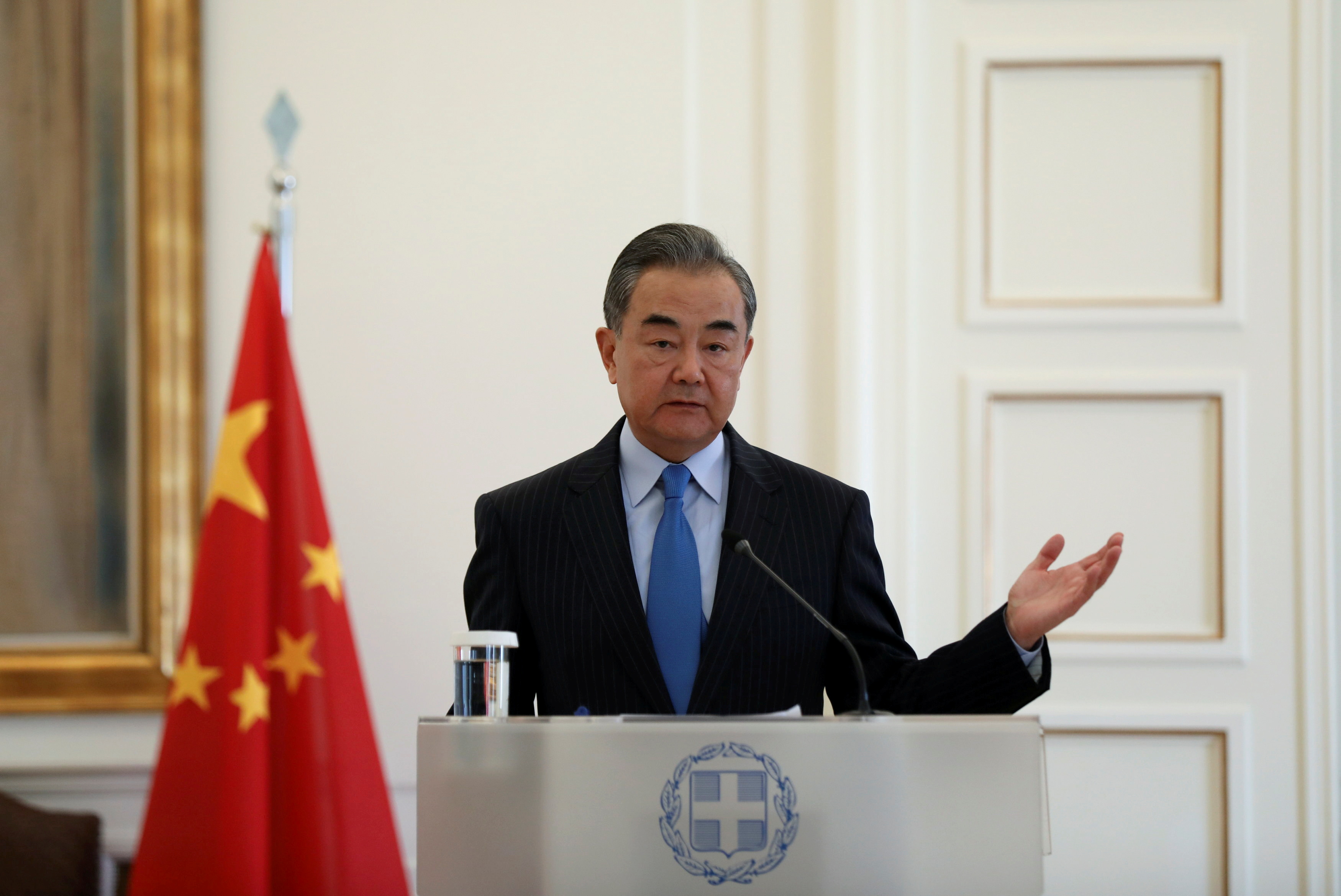 China's State Councillor and Foreign Minister Wang Yi attends a news conference following talks in Athens, Greece