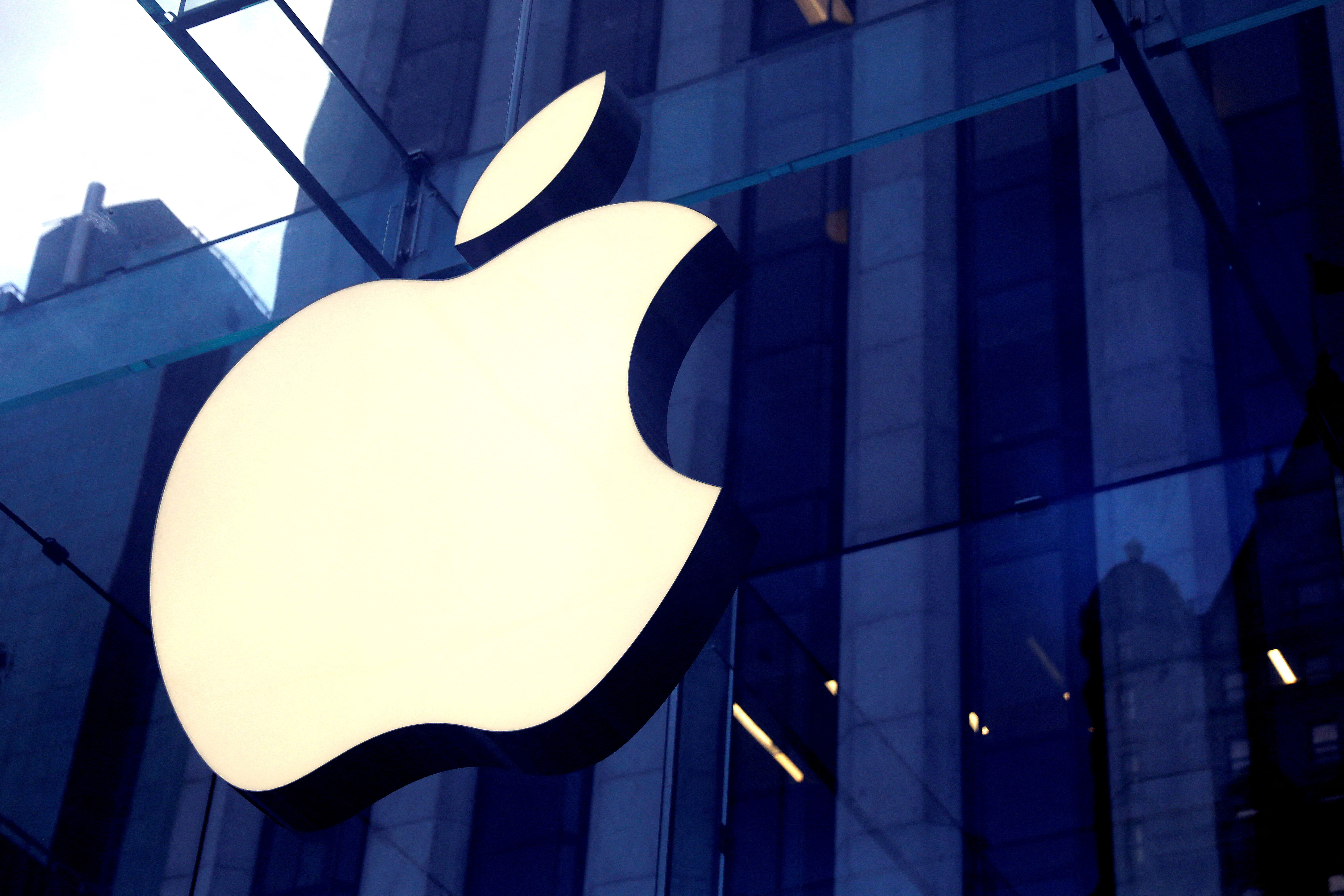 The Apple logo is seen hanging at the entrance to the Apple store on 5th Avenue in New York