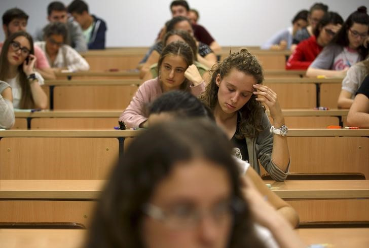 Students sit for a university entrance examination at a lecture hall in the Andalusian capital of Seville, southern Spain