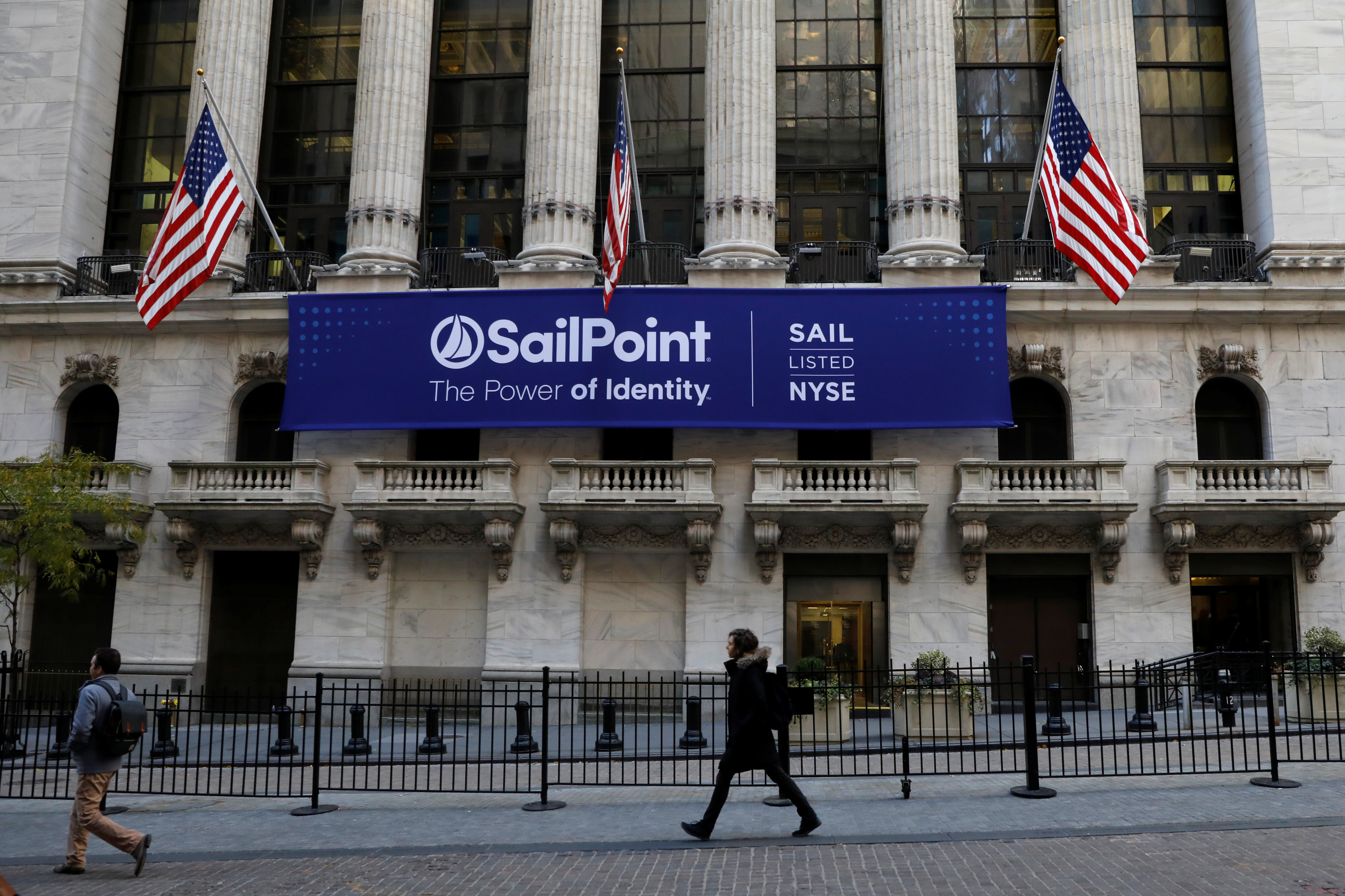 A banner for Sailpoint Technologies Holdings Inc. is displayed on the front of the NYSE in New York