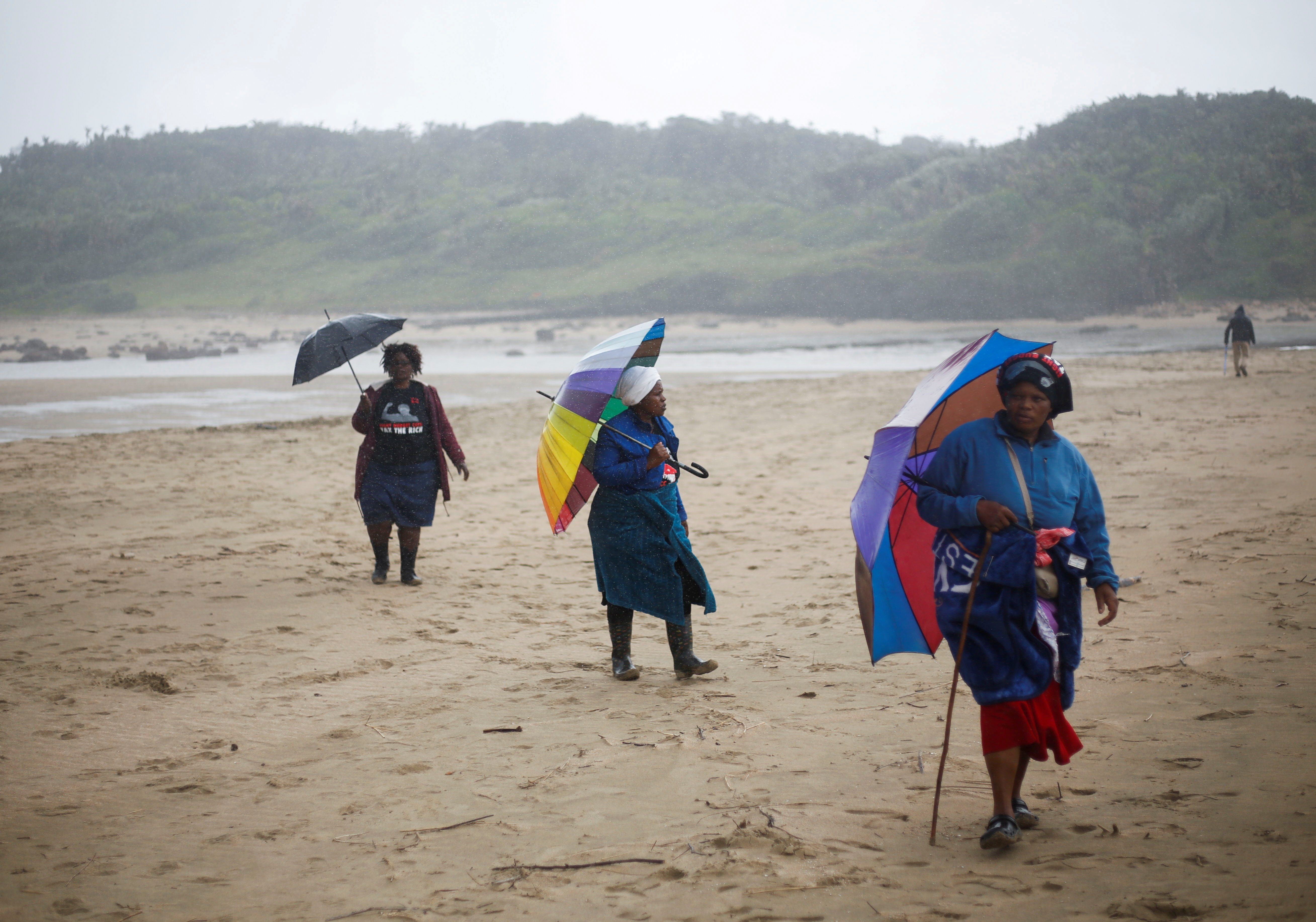 Residents join a demonstration against Royal Dutch Shell's plans to start seismic surveys to explore petroleum systems off the country's popular Wild Coast at Mzamba Beach, Sigidi, South Africa, December 5, 2021. REUTERS/Rogan Ward