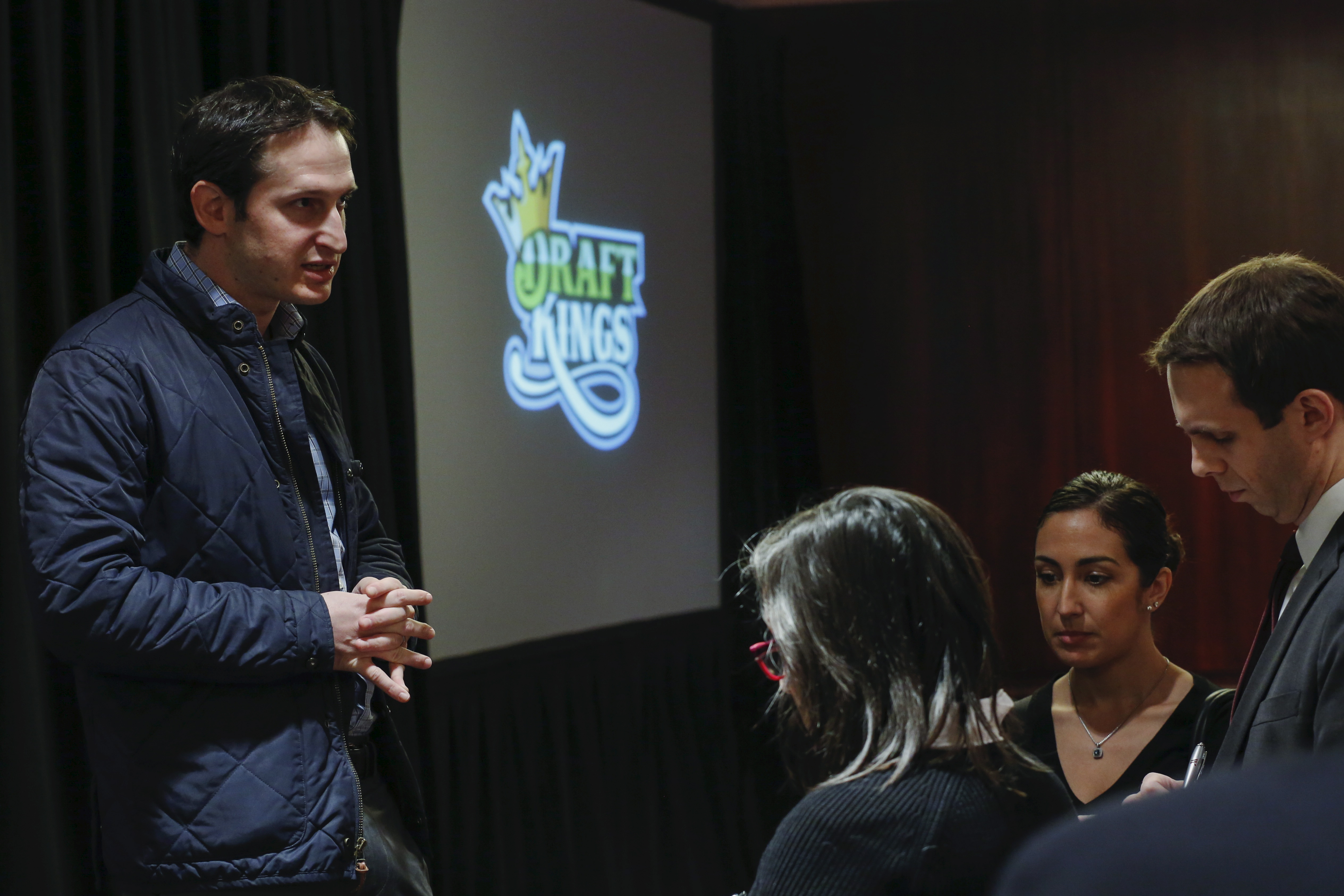 DraftKings CEO Jason Robins speaks to reporters after speaking during the DFS Players Conference in New York