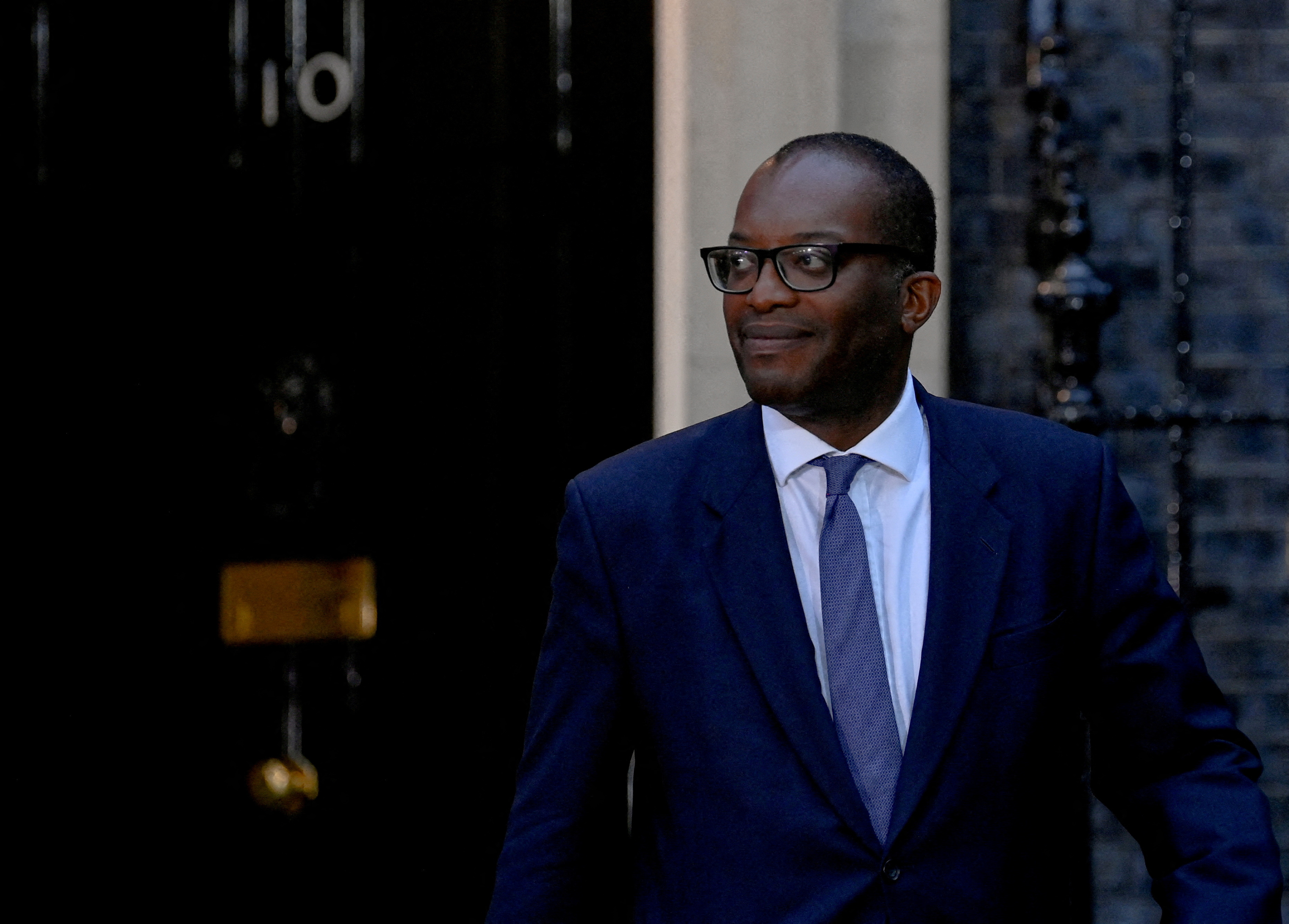 New British Chancellor of the Exchequer Kwasi Kwarteng walks outside Number 10 Downing Street in London