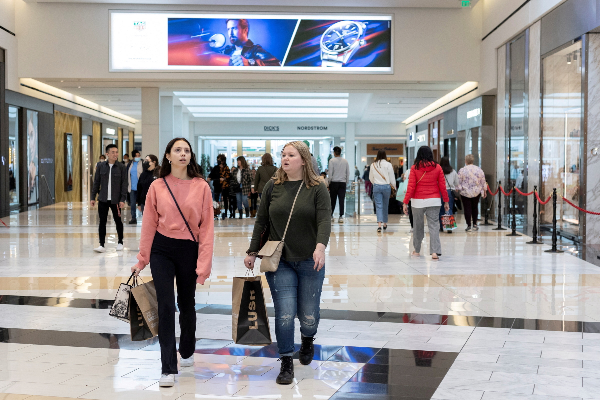 People walk inside King of Prussia shopping mall in Pennsylvania