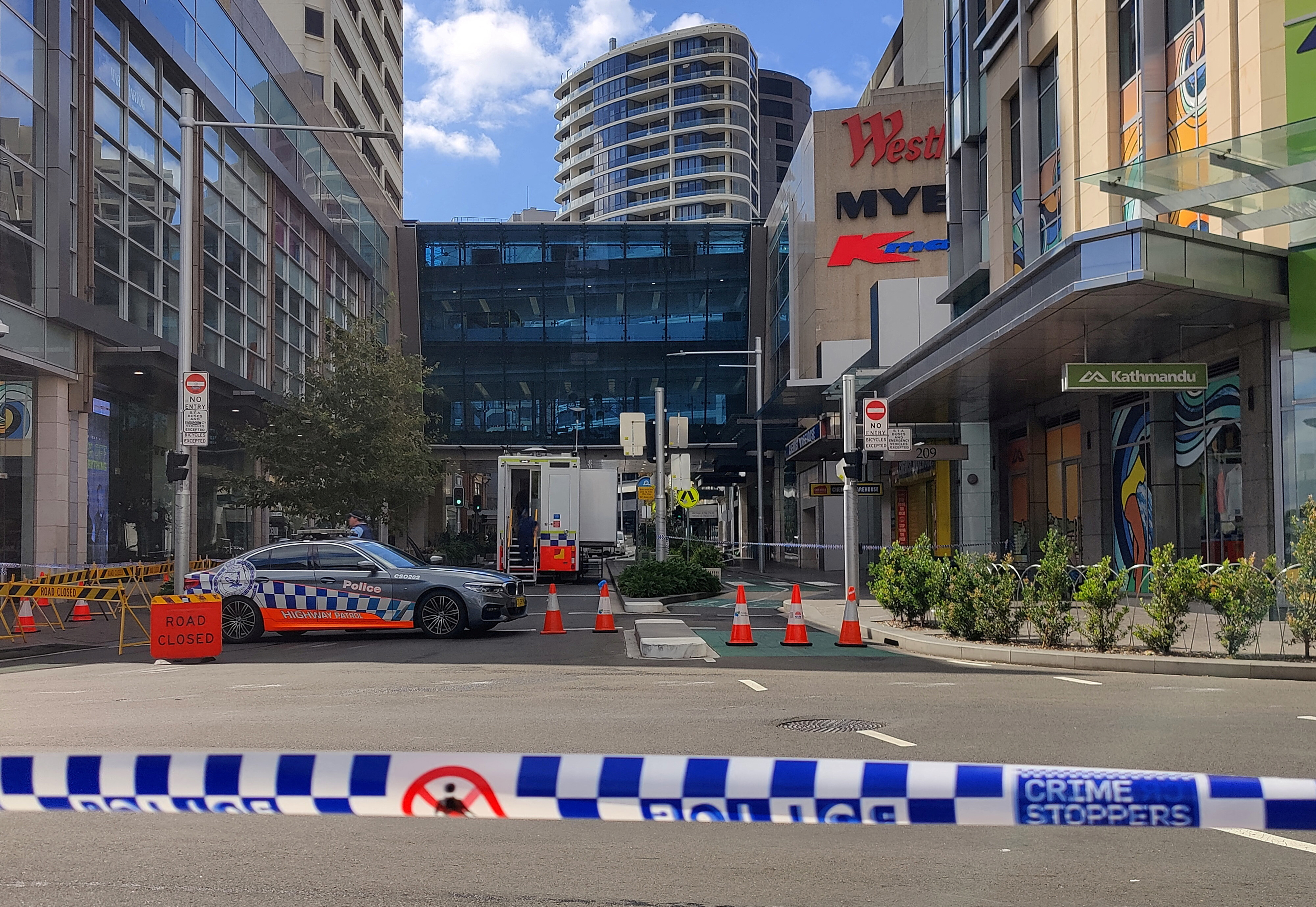 A view of a police car outside Westfield Bondi Junction as the mall remains under lockdown following Saturday’s stabbings in Sydney