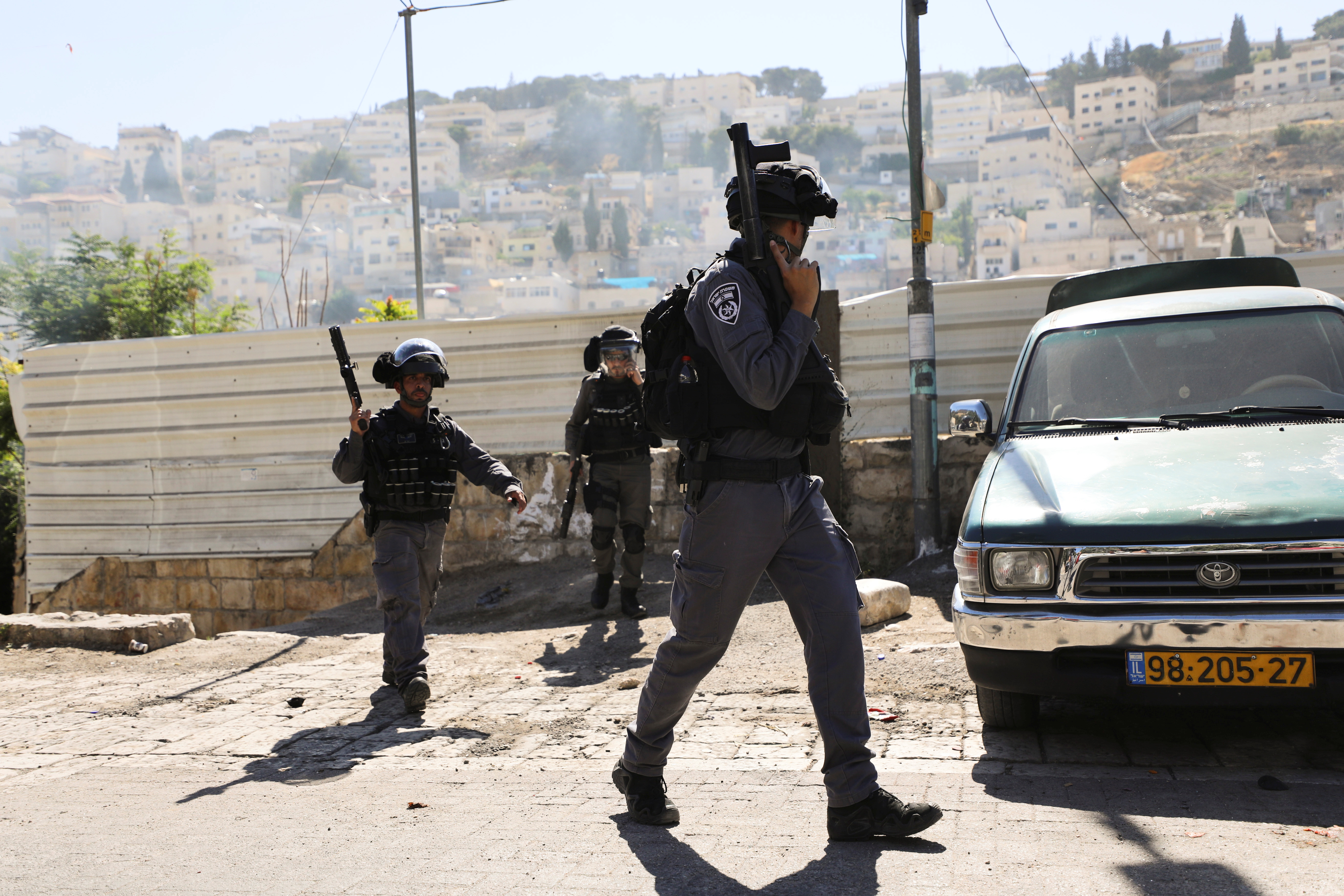 Israeli security force members hold their weapons during clashes with Palestinians which erupted over Israel's demolition of a shop in the Palestinian neighbourhood of Silwan in East Jerusalem