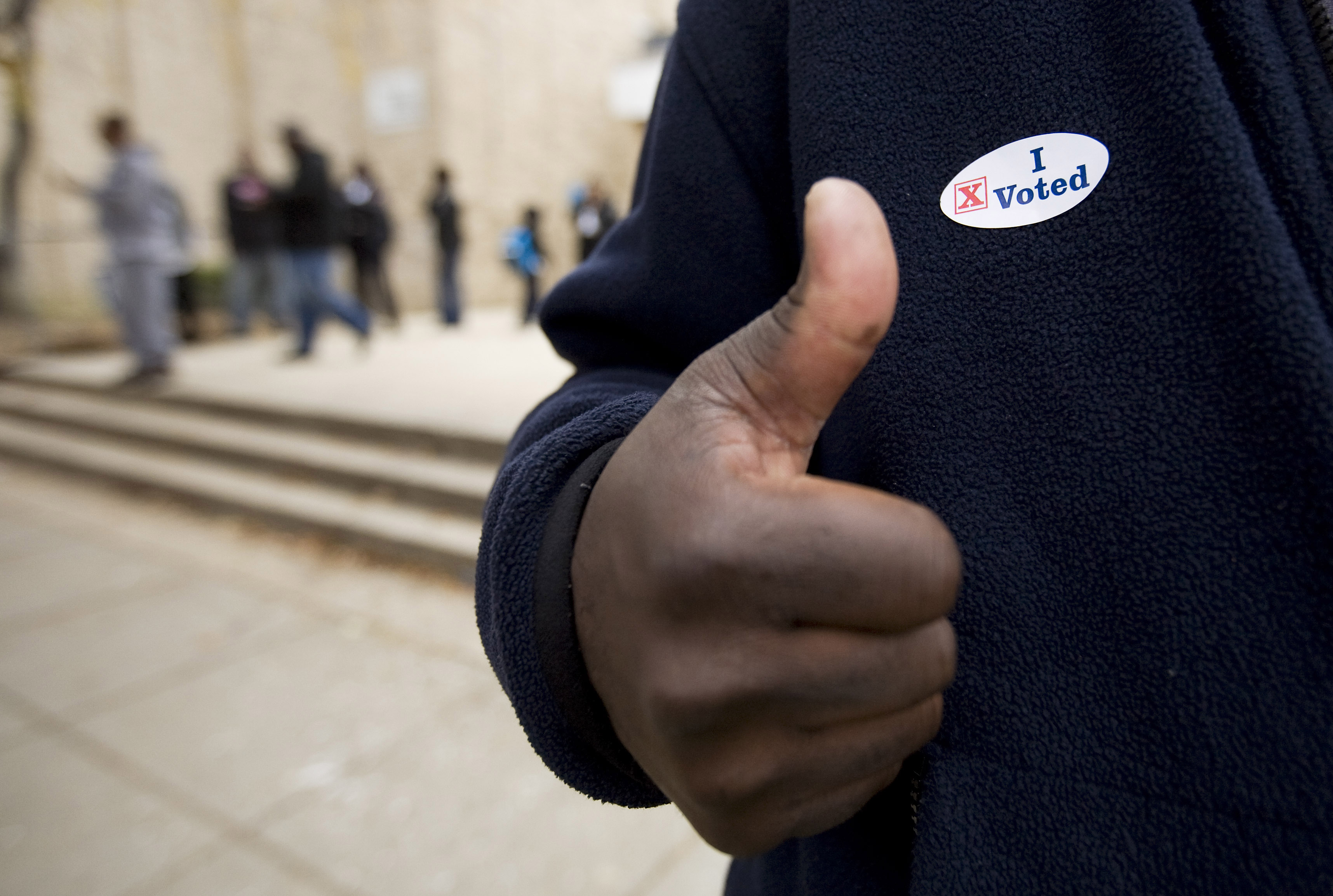 Voter gives thumb's up after voting in the Anacostia neighborhood of  Washington