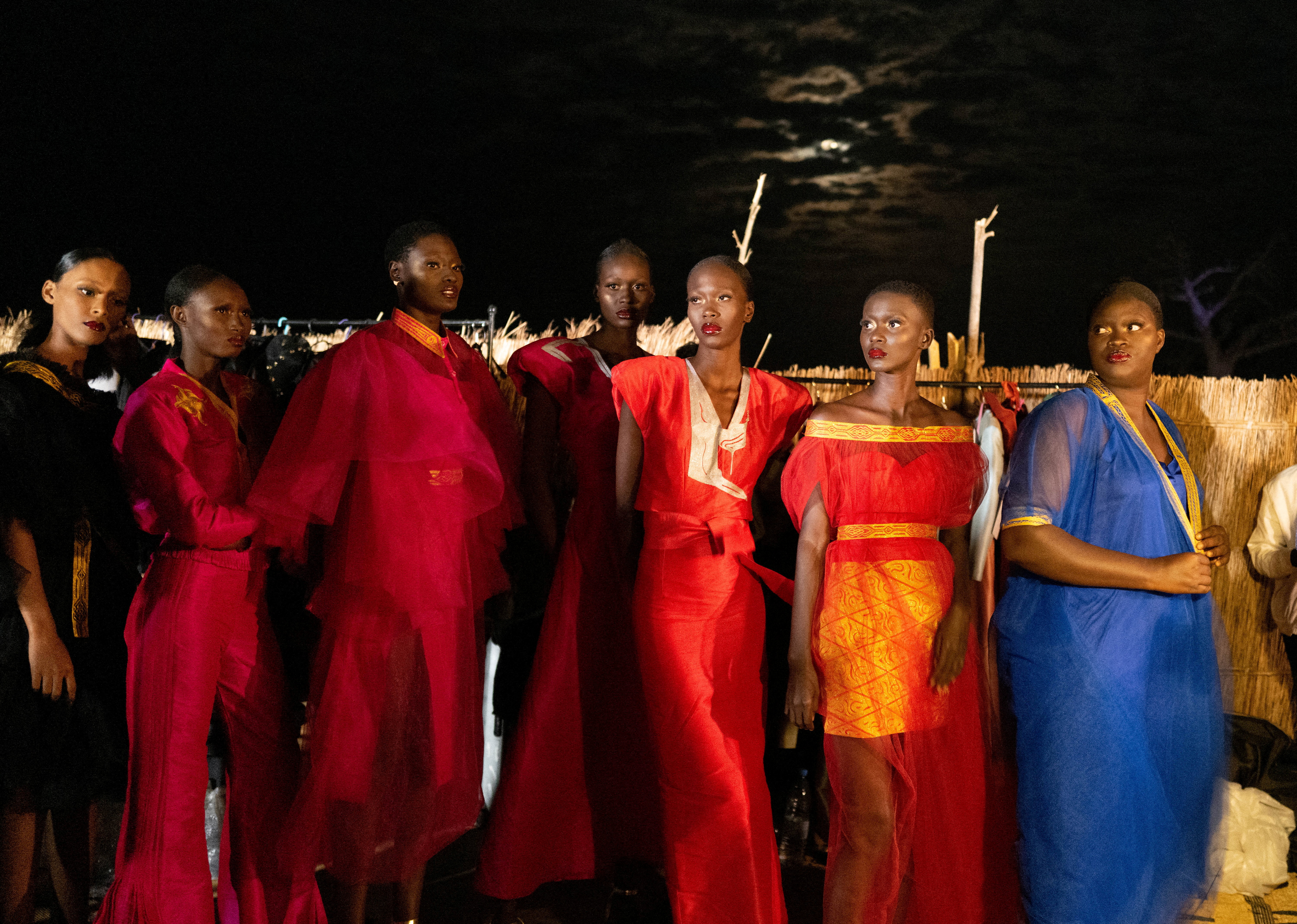 Models wait backstage during the 19th annual Dakar Fashion Week, at the Baobad forest,  in Mbour
