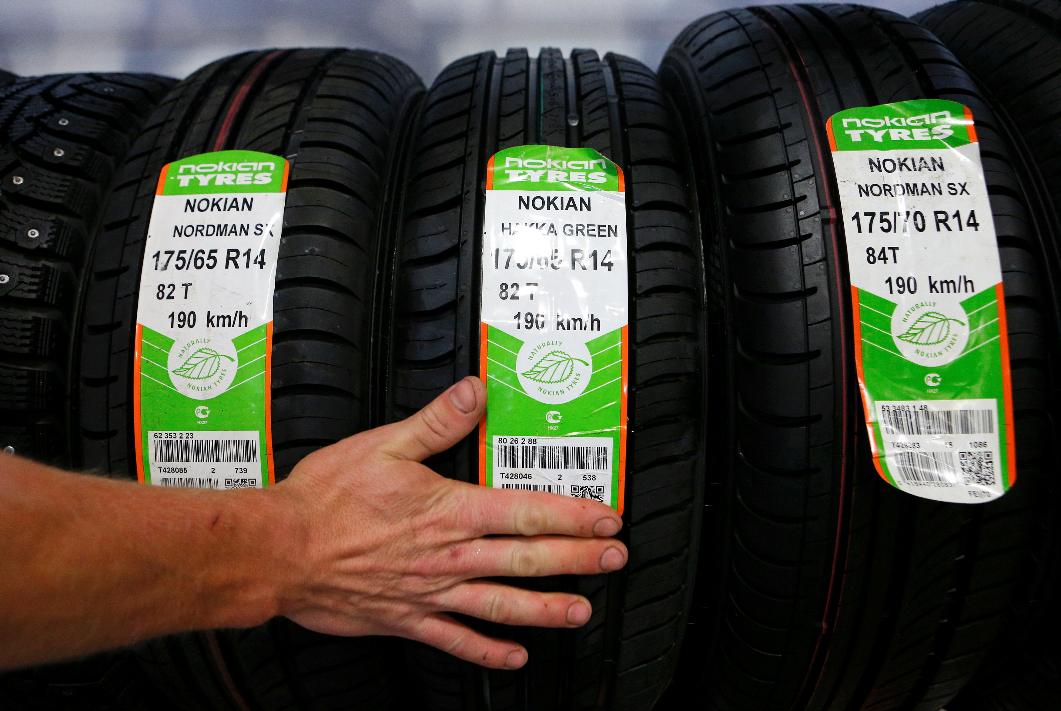 An employee sorts Nokian tyres at a tyre assembling centre and shop in Moscow