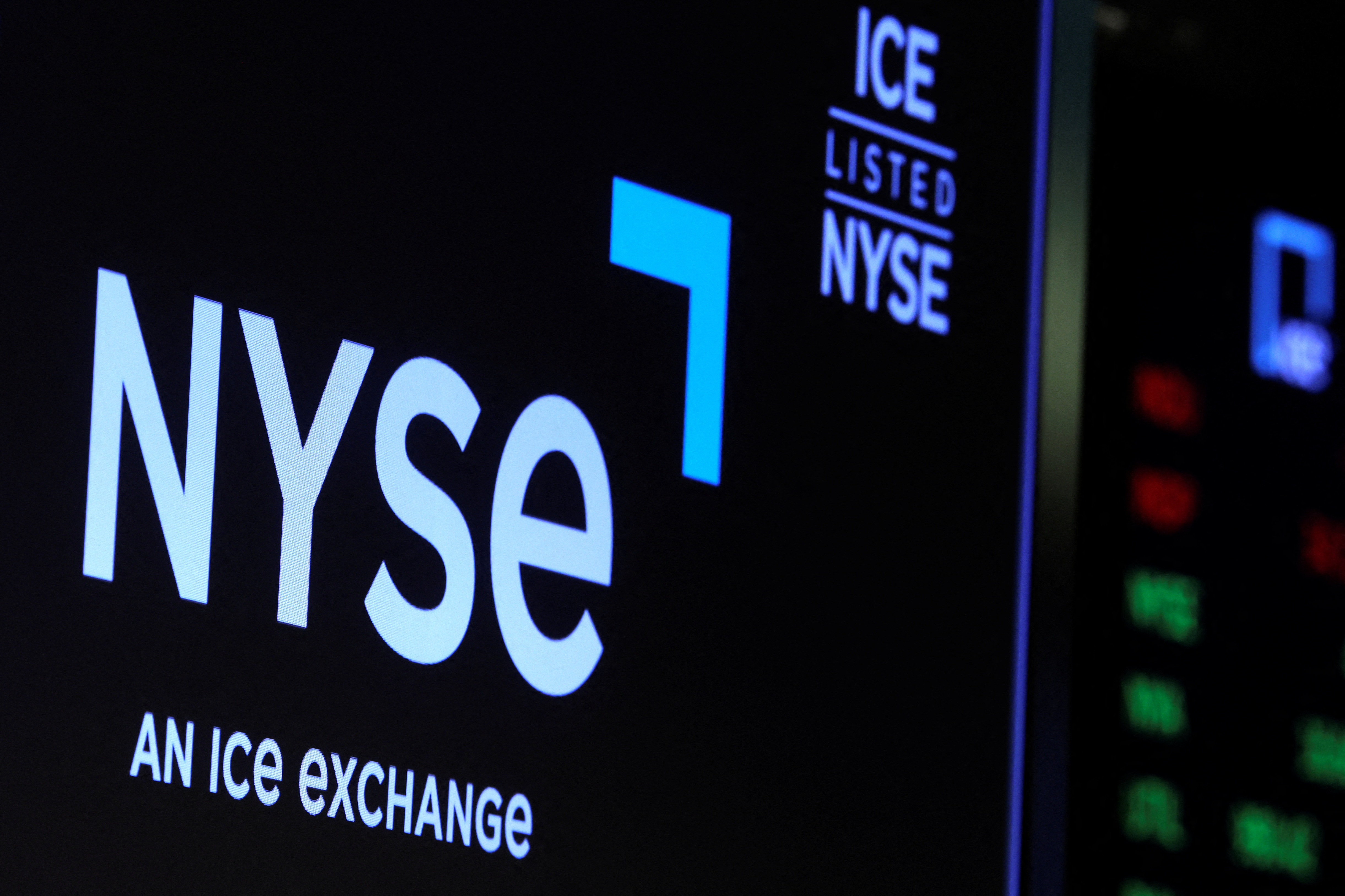 A screen displays the ICE trading information on the floor of the New York Stock Exchange (NYSE) in New York