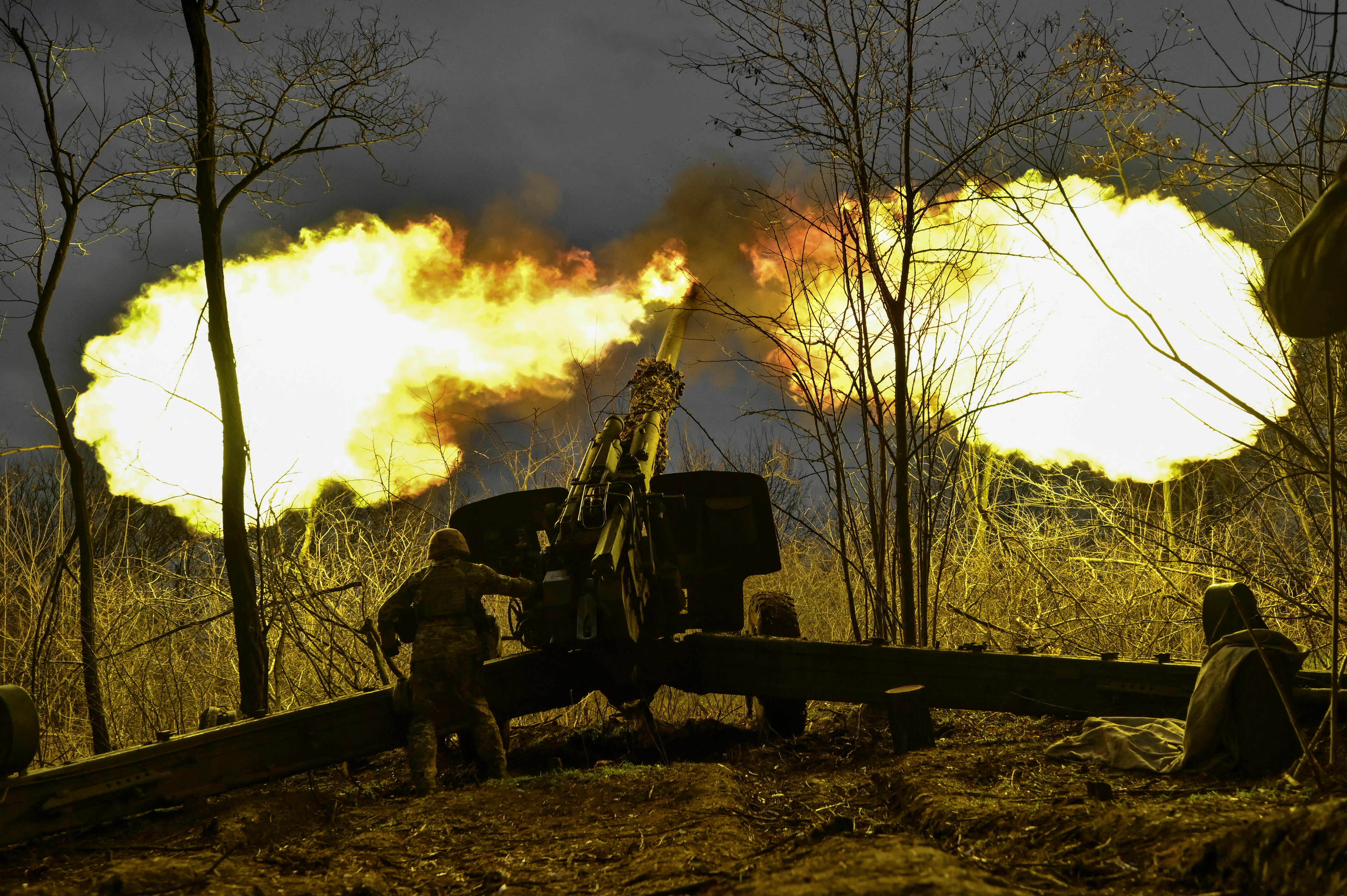 Ukrainian serviceman fires with a 2A65 Msta-B howitzer towards Russian troops in a frontline in Zaporizhzhia region
