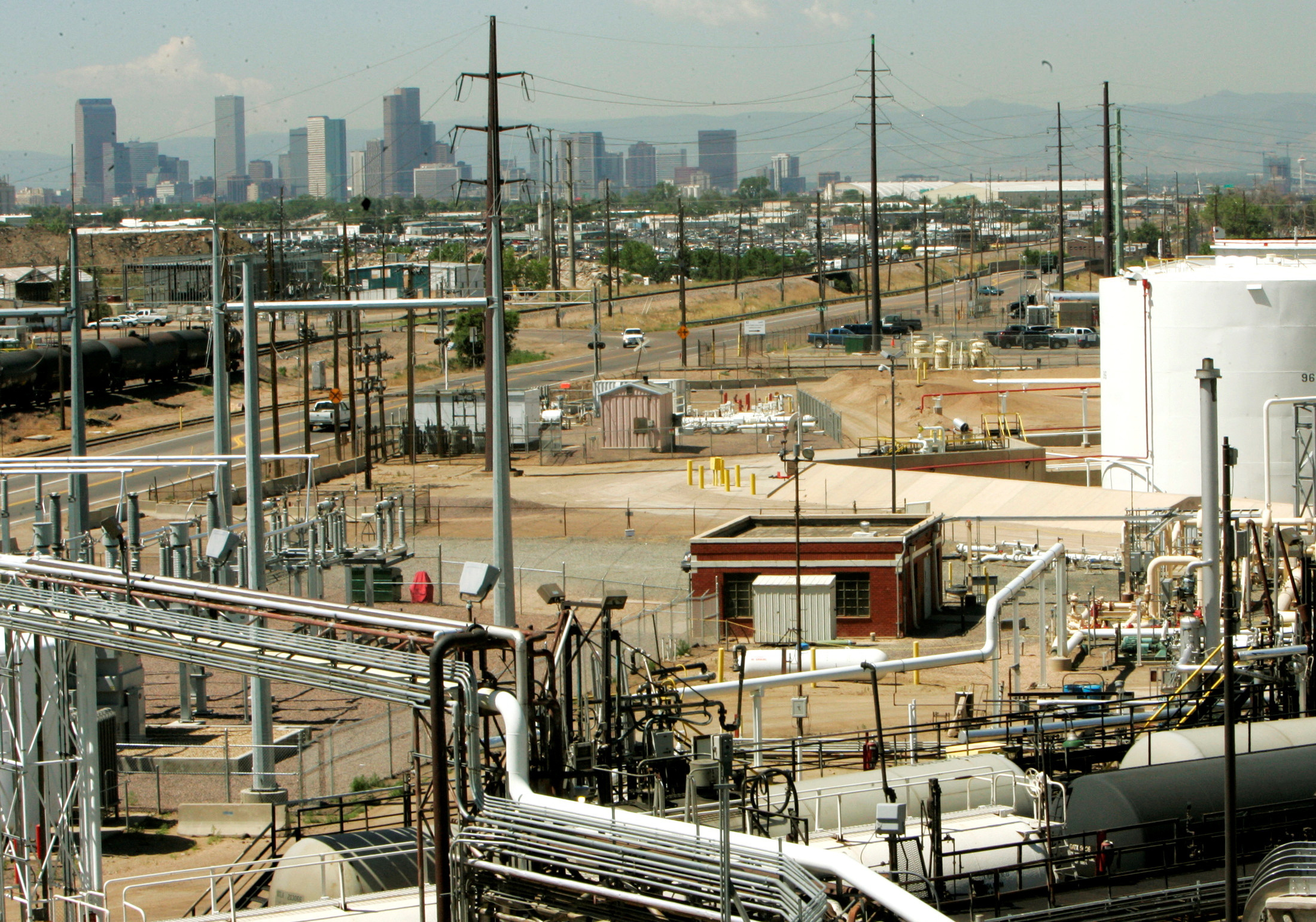 Downtown Denver is seen in the background from the Suncor Energy refinery in Denver