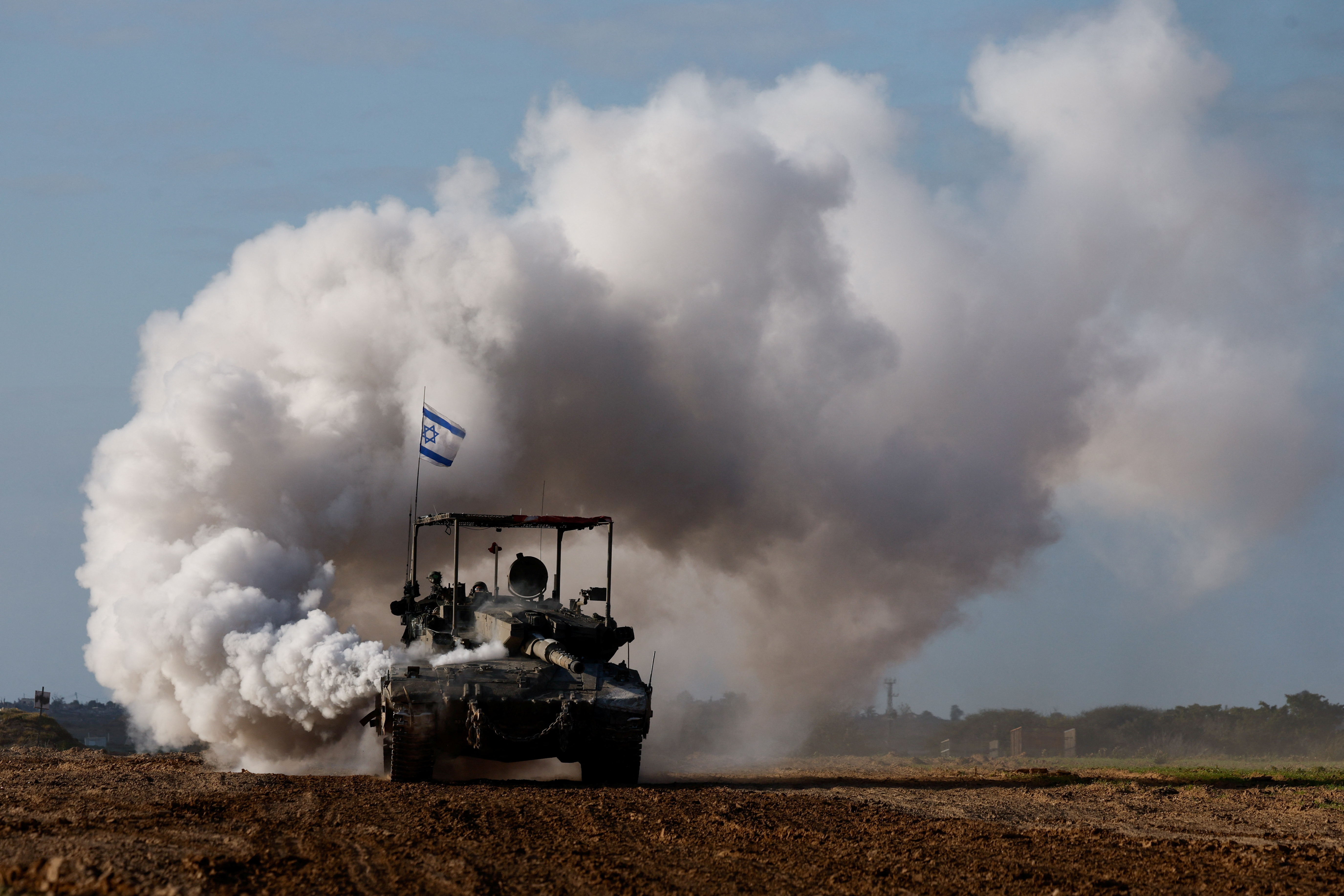 An Israeli tank manoeuvres near the Israel-Gaza border