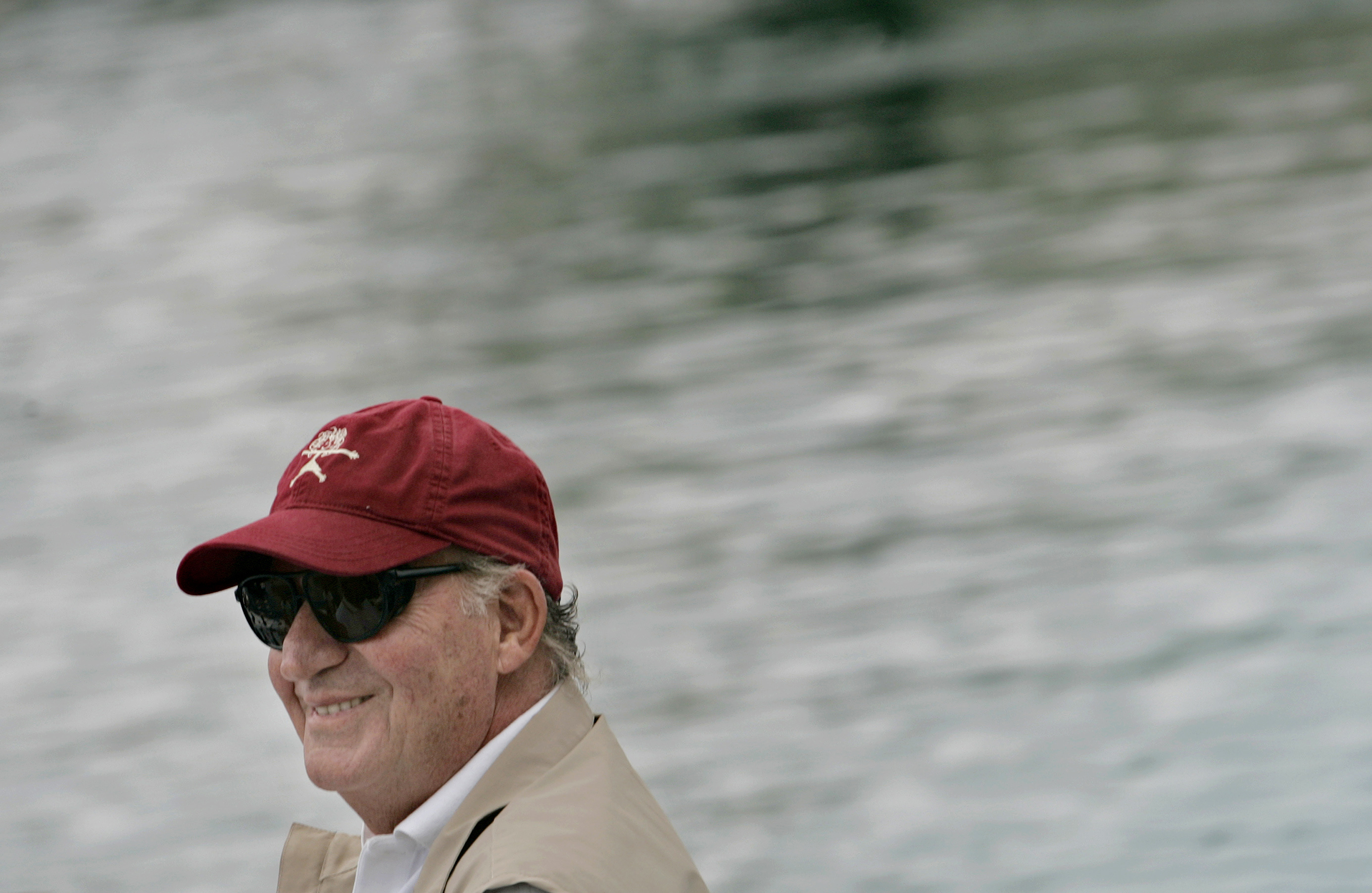 Spain's King Juan Carlos smiles aboard the yacht 