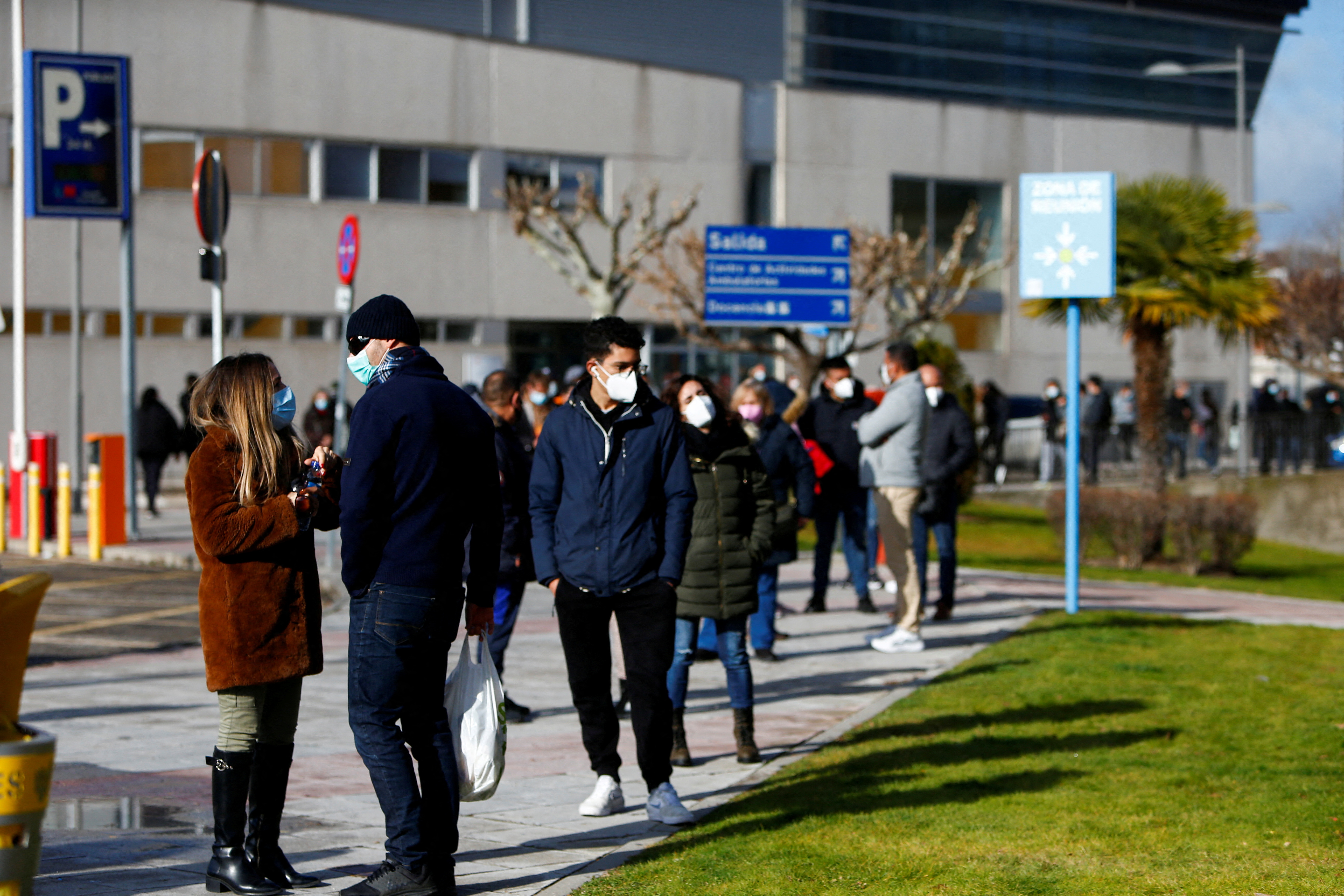 People queue to get tested for the coronavirus disease (COVID-19) after the Christmas holiday break, amid the COVID-19 pandemic, at Doce de Octubre Hospital in Madrid
