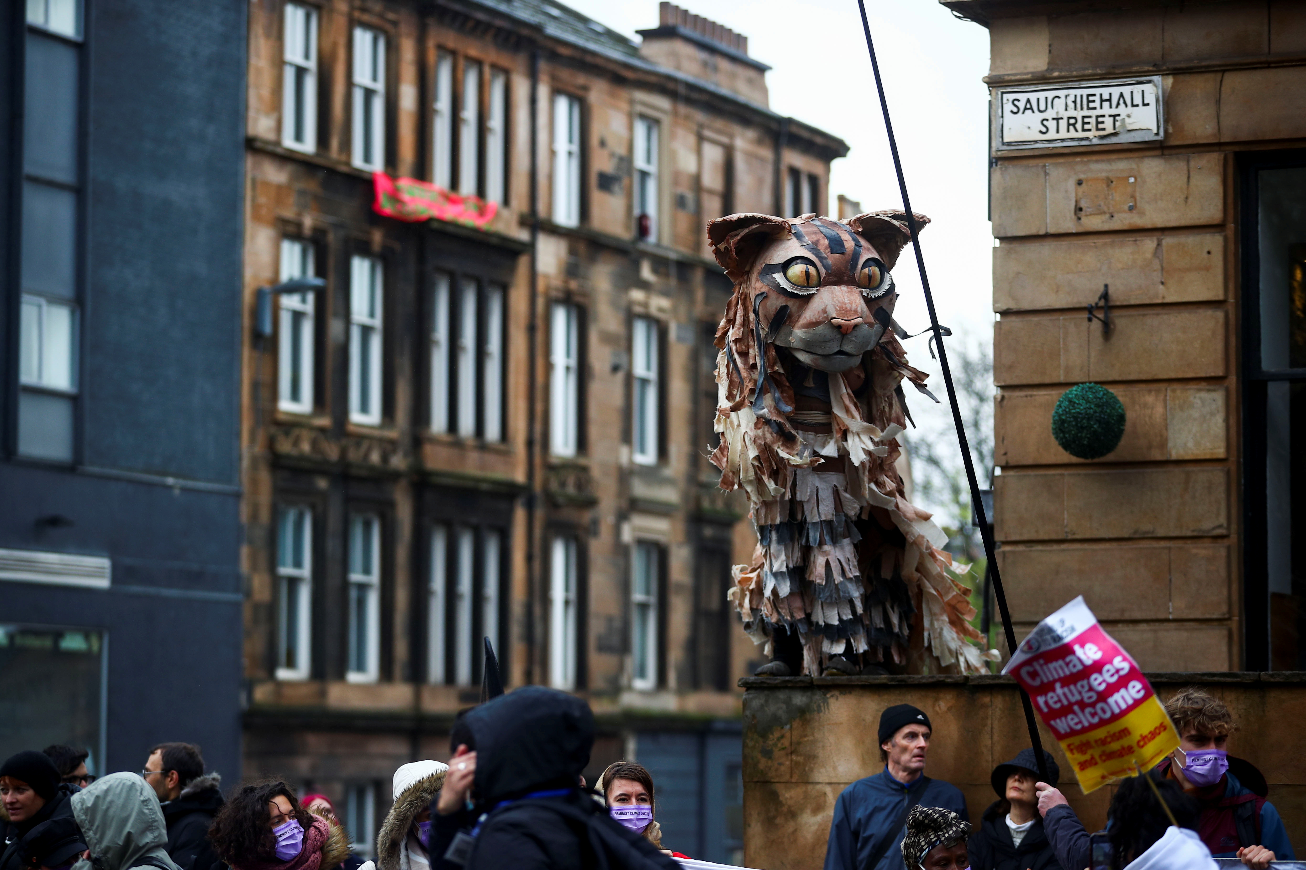 A demonstrator dressed up as a cat attends a protest as the UN Climate Change Conference (COP26) takes place, in Glasgow, Scotland, Britain, November 6, 2021. REUTERS/Hannah McKay
