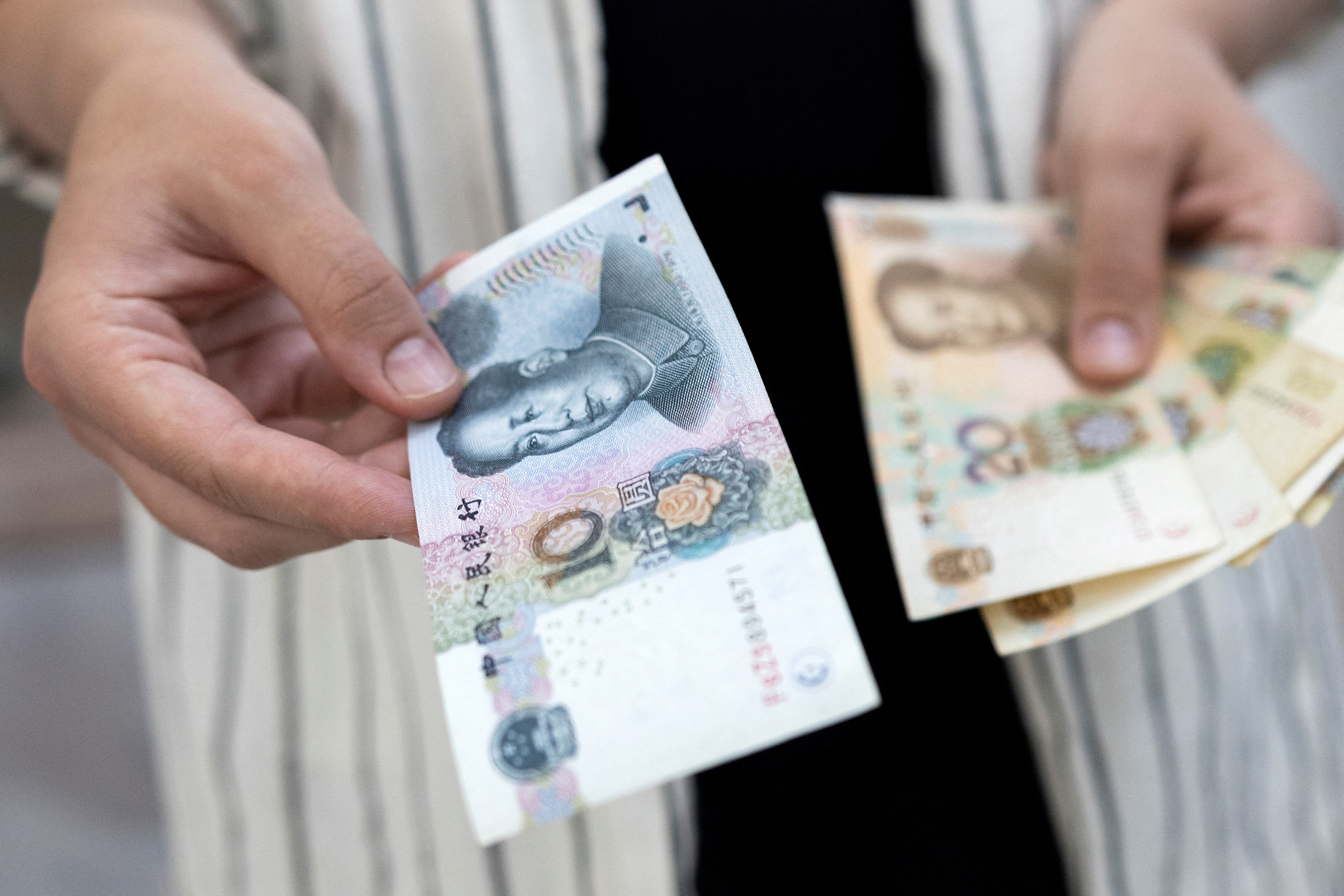 Illustration shows Chinese Yuan banknotes