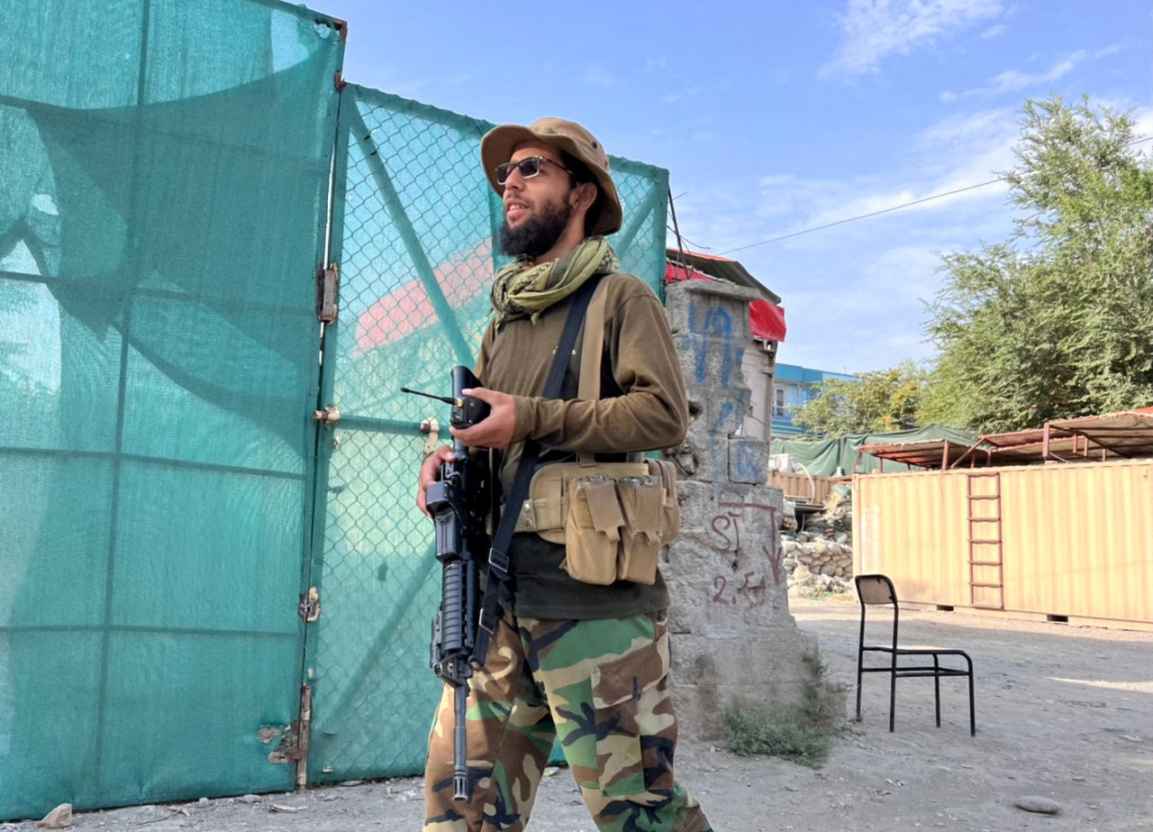 A Taliban fighter stands guard near the site where Al Qaeda leader Ayman al-Zawahiri was killed in a U.S. strike over the weekend, in Kabul