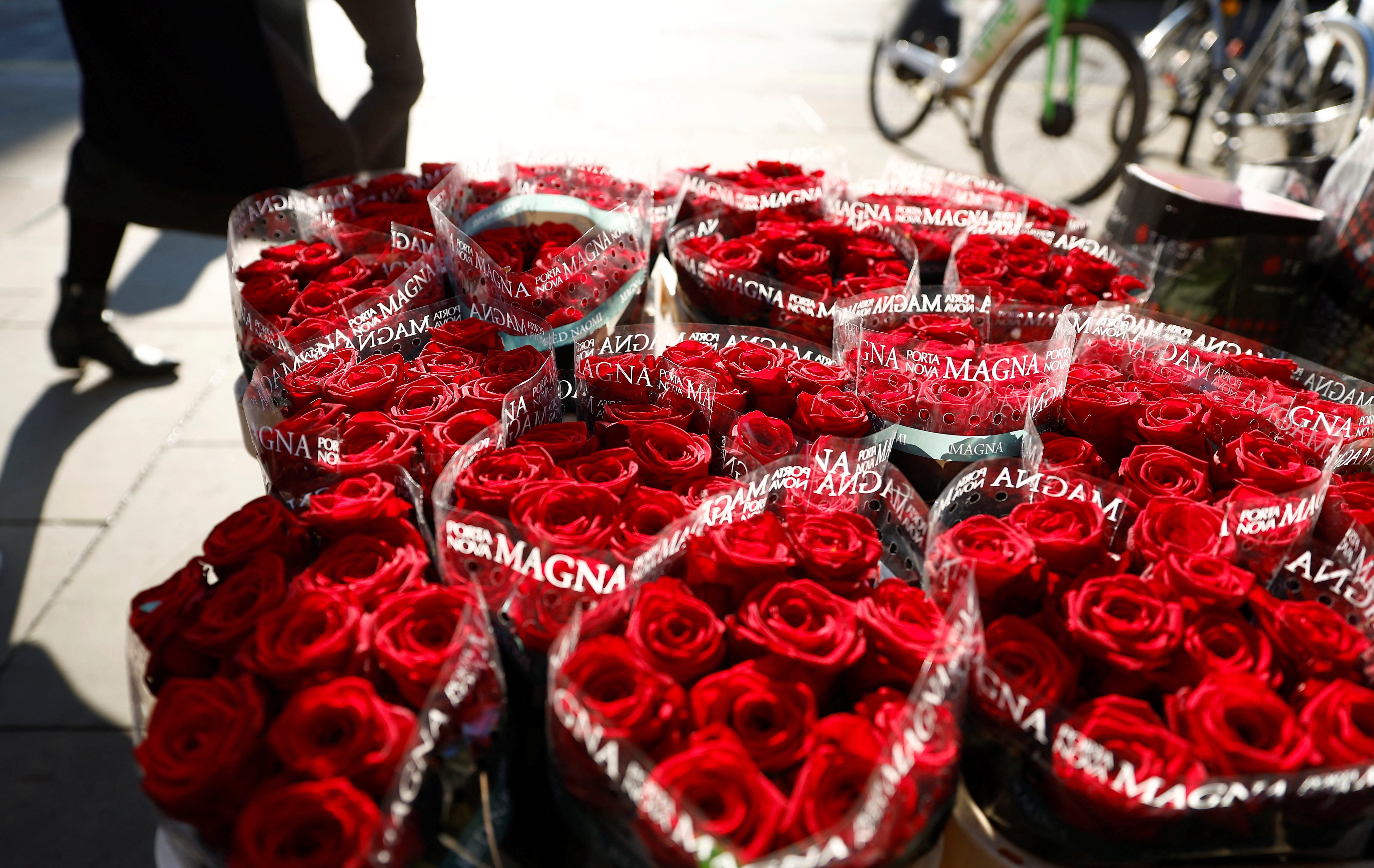 Red roses on sale are displayed at a flower seller ahead of Valentines Day in London