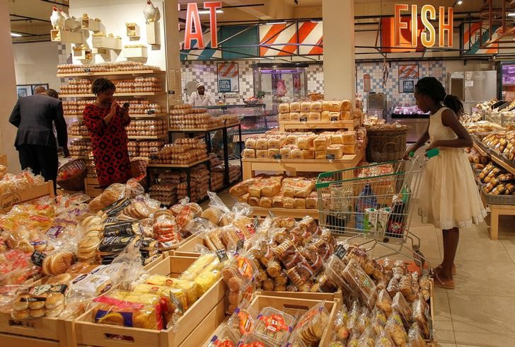 People buy bread in the Naivas Supermarket in Nairobi