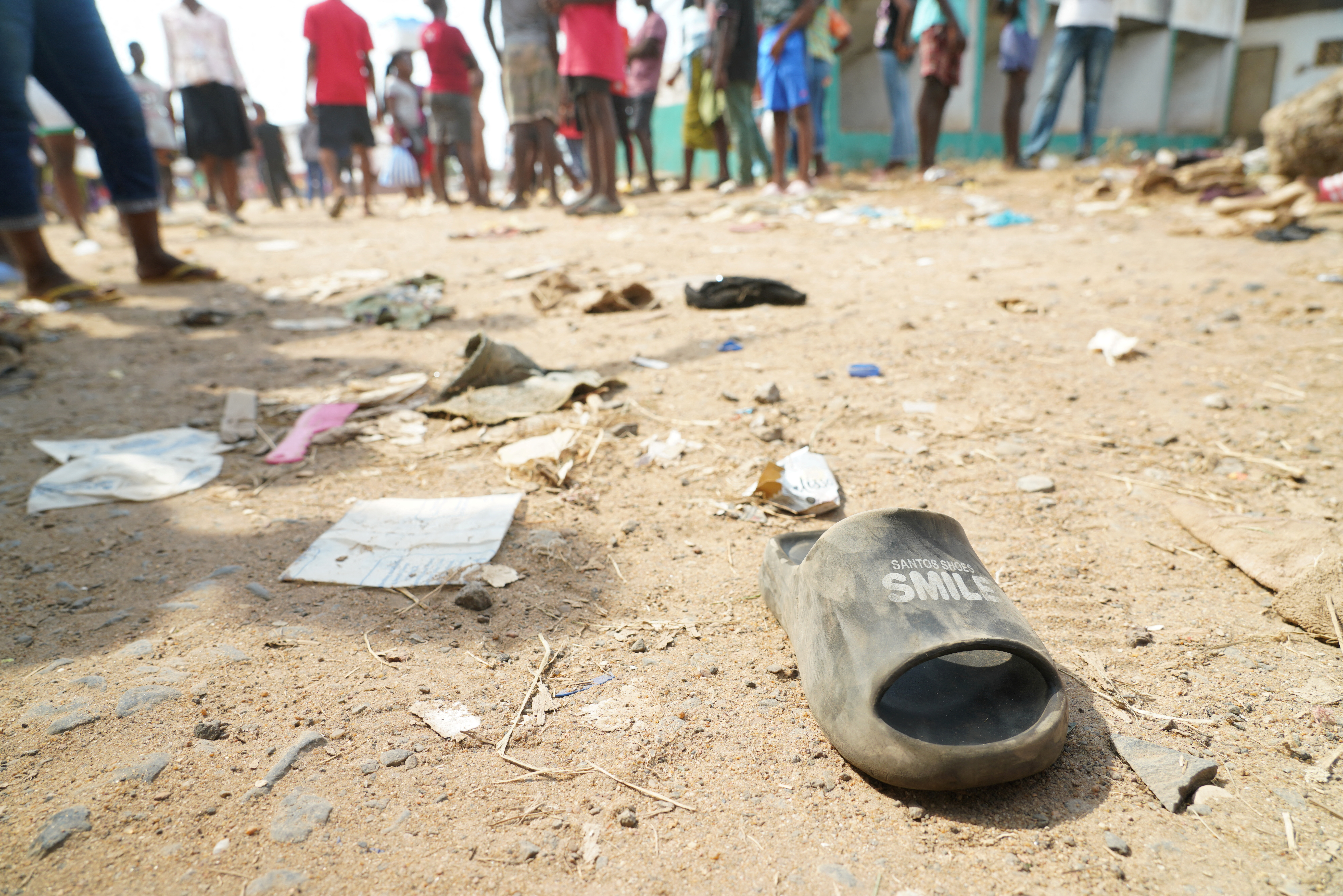 A shoe is pictured on the ground after a stampede at a church gathering killed 29 people in Monrovia