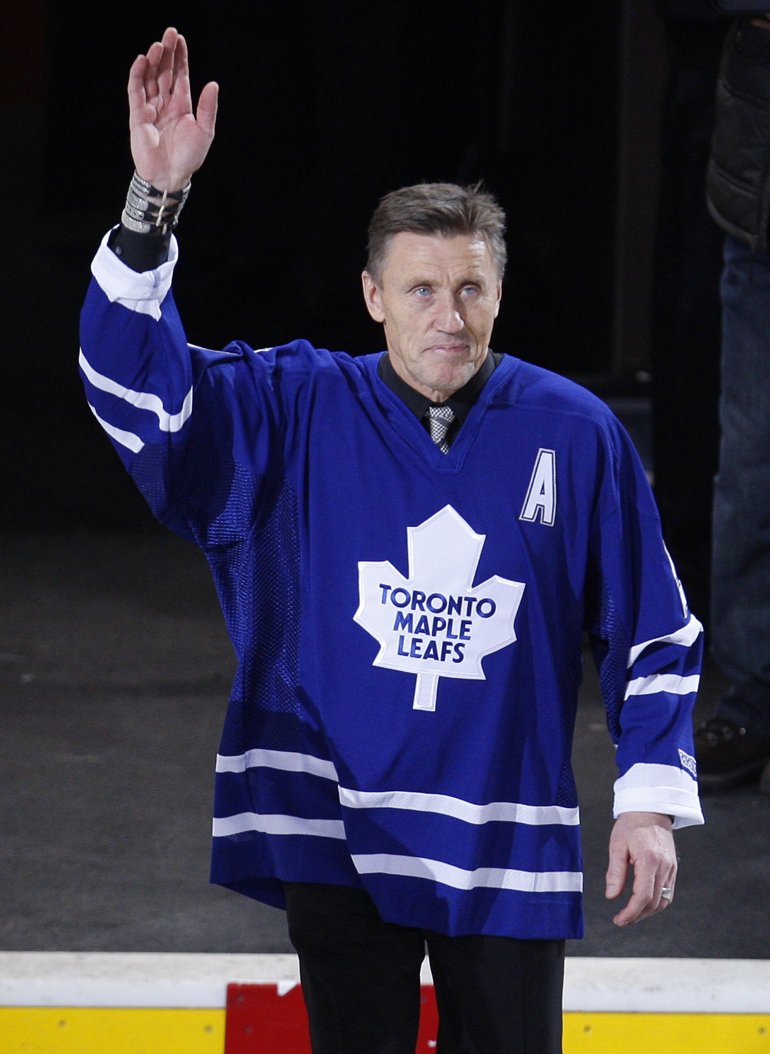 Toronto Maple Leafs great Borje Salming waves during a pre-game ceremony before the team's NHL hockey game against the Montreal Canadiens