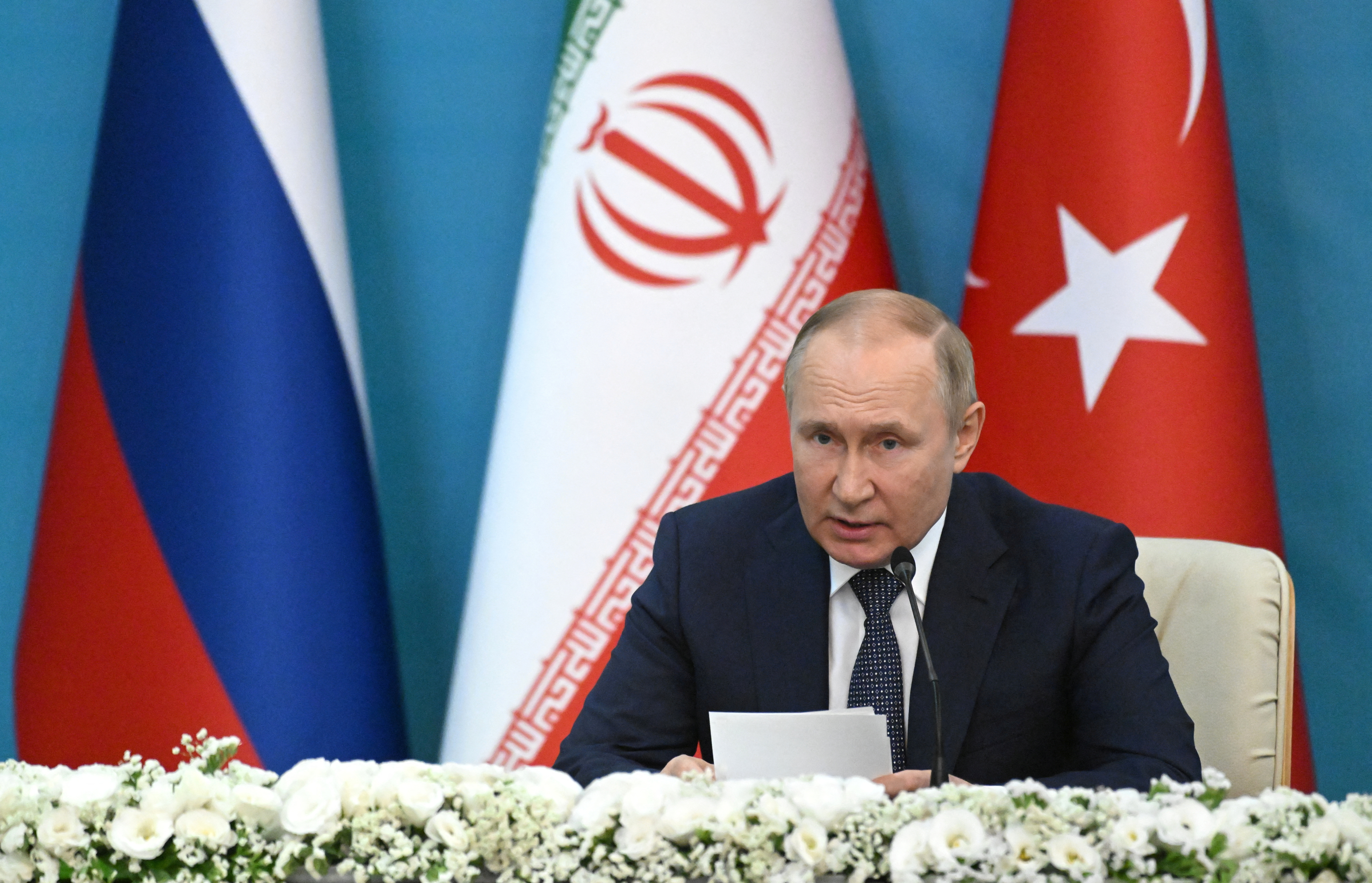Russian President Putin attends a news conference in Tehran