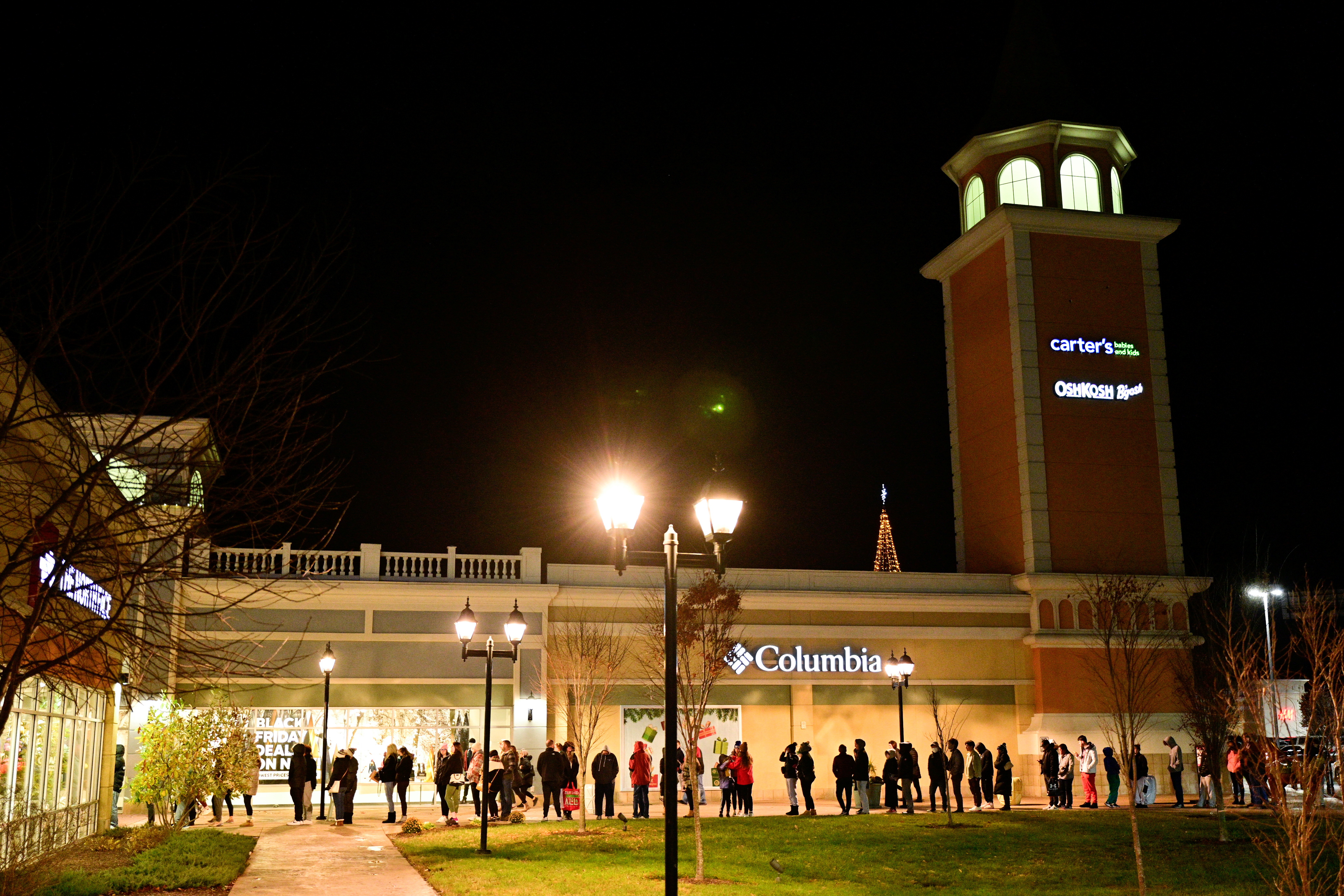 Shoppers wait in line for stores to open as Black Friday sales begin at The Outlet Shoppes of the Bluegrass in Simpsonville, Kentucky, U.S., November 26, 2021. REUTERS/Jon Cherry