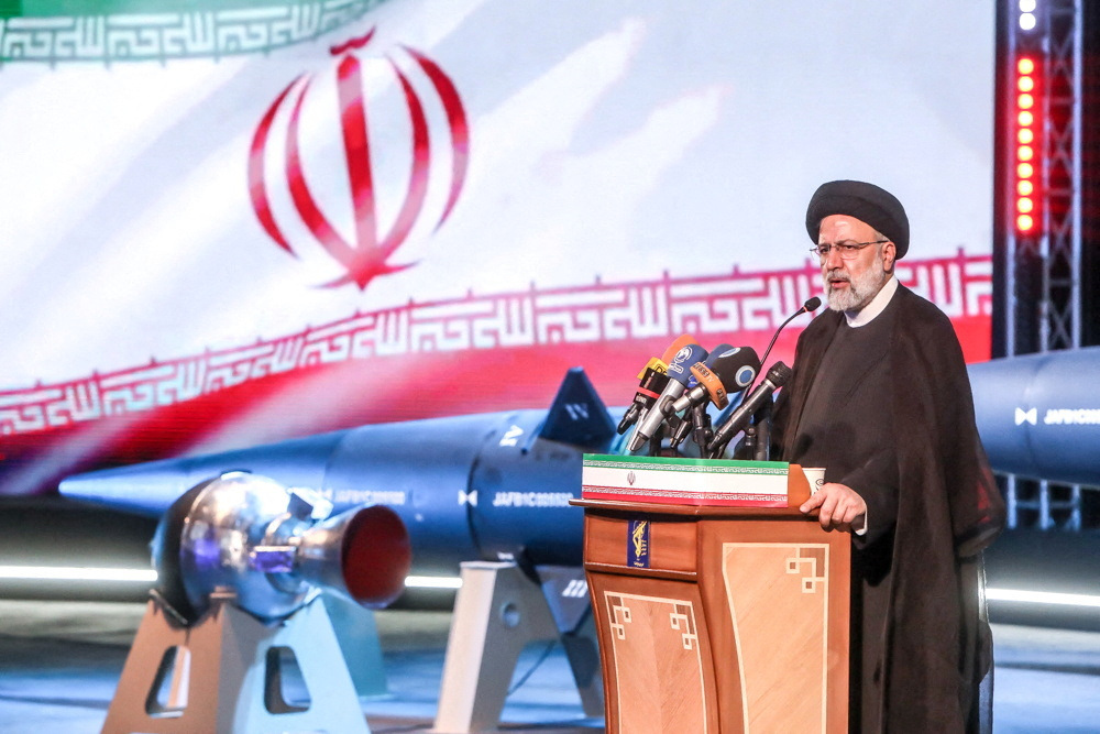 Iranian President Ebrahim Raisi speaks during the unveiling ceremony of the new ballistic missile called "Fattah" with a range of 1400 km, in Tehran