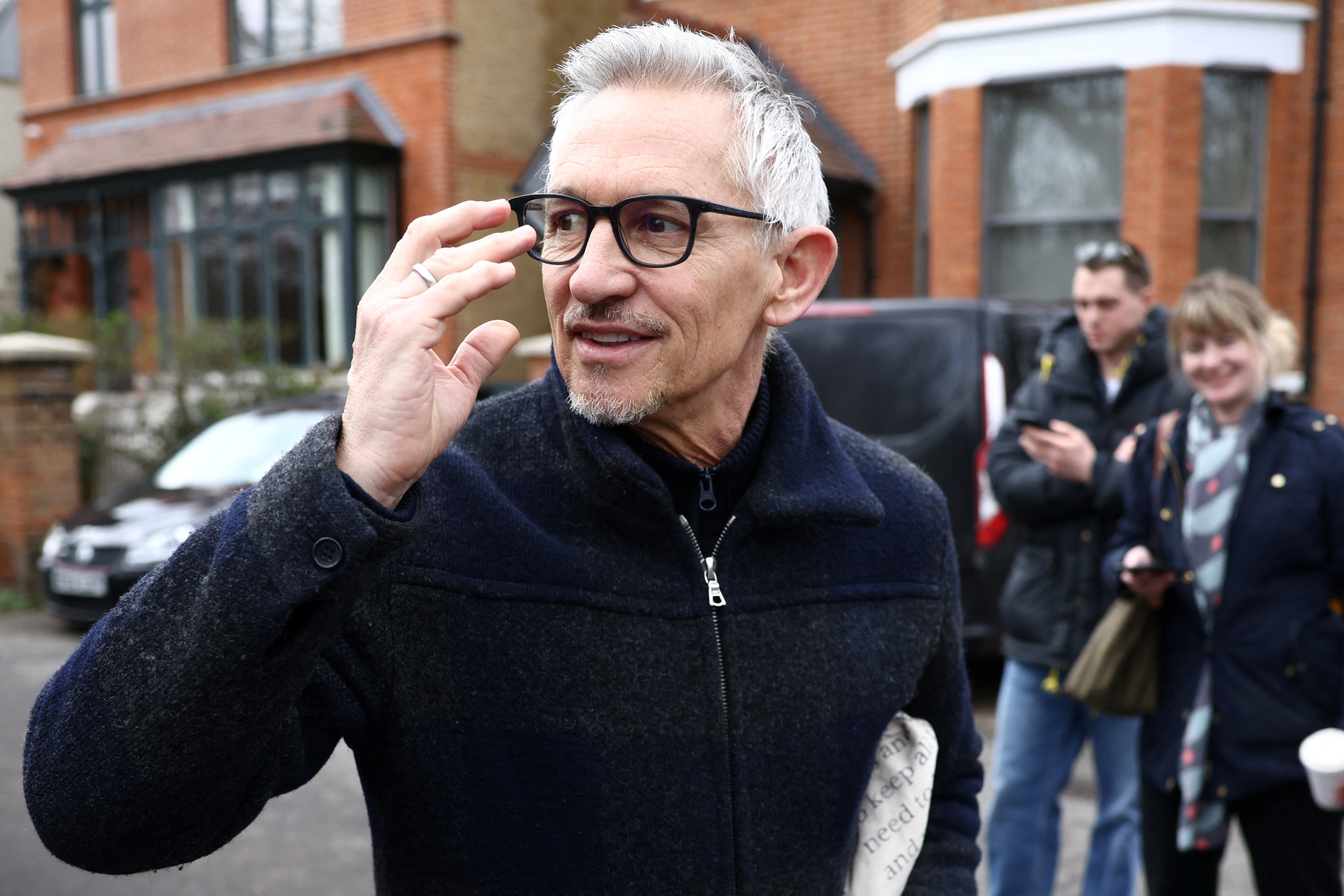 Former British football player and BBC presenter Gary Lineker walks outsside his home in London