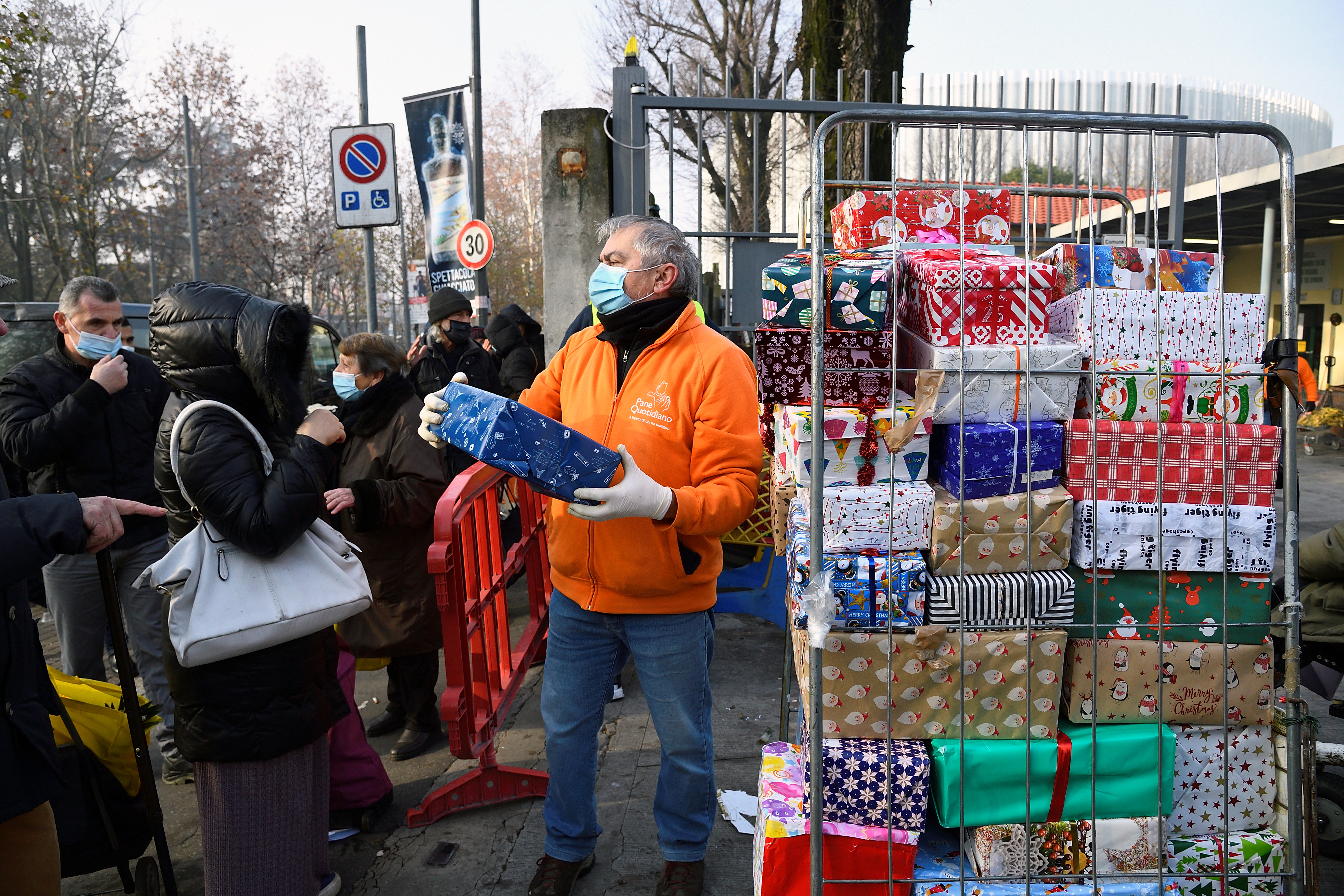Queues form outside Milan food banks as crisis bites ahead of Christmas