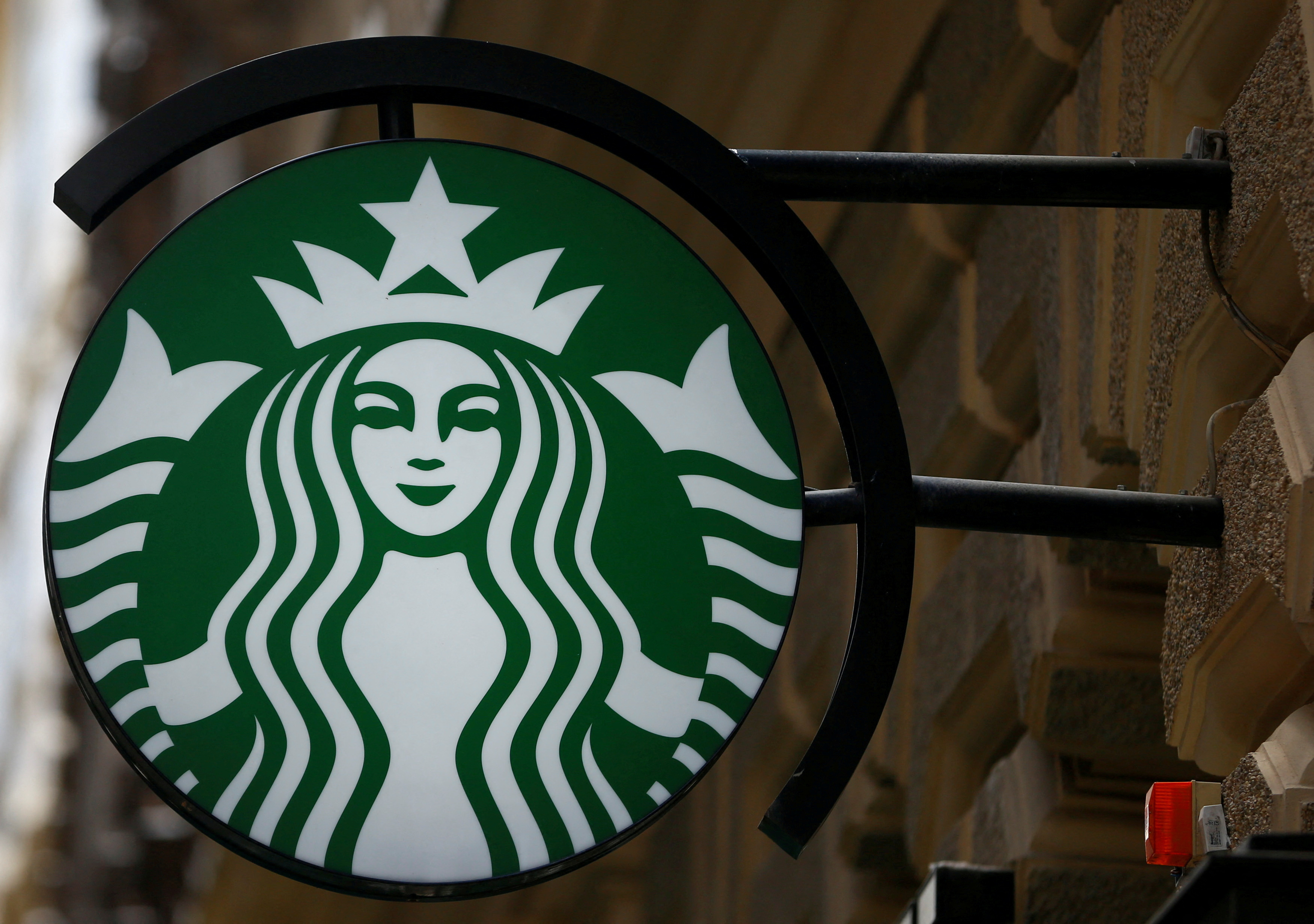 A Starbucks logo is seen at a Starbucks coffee shop in Vienna