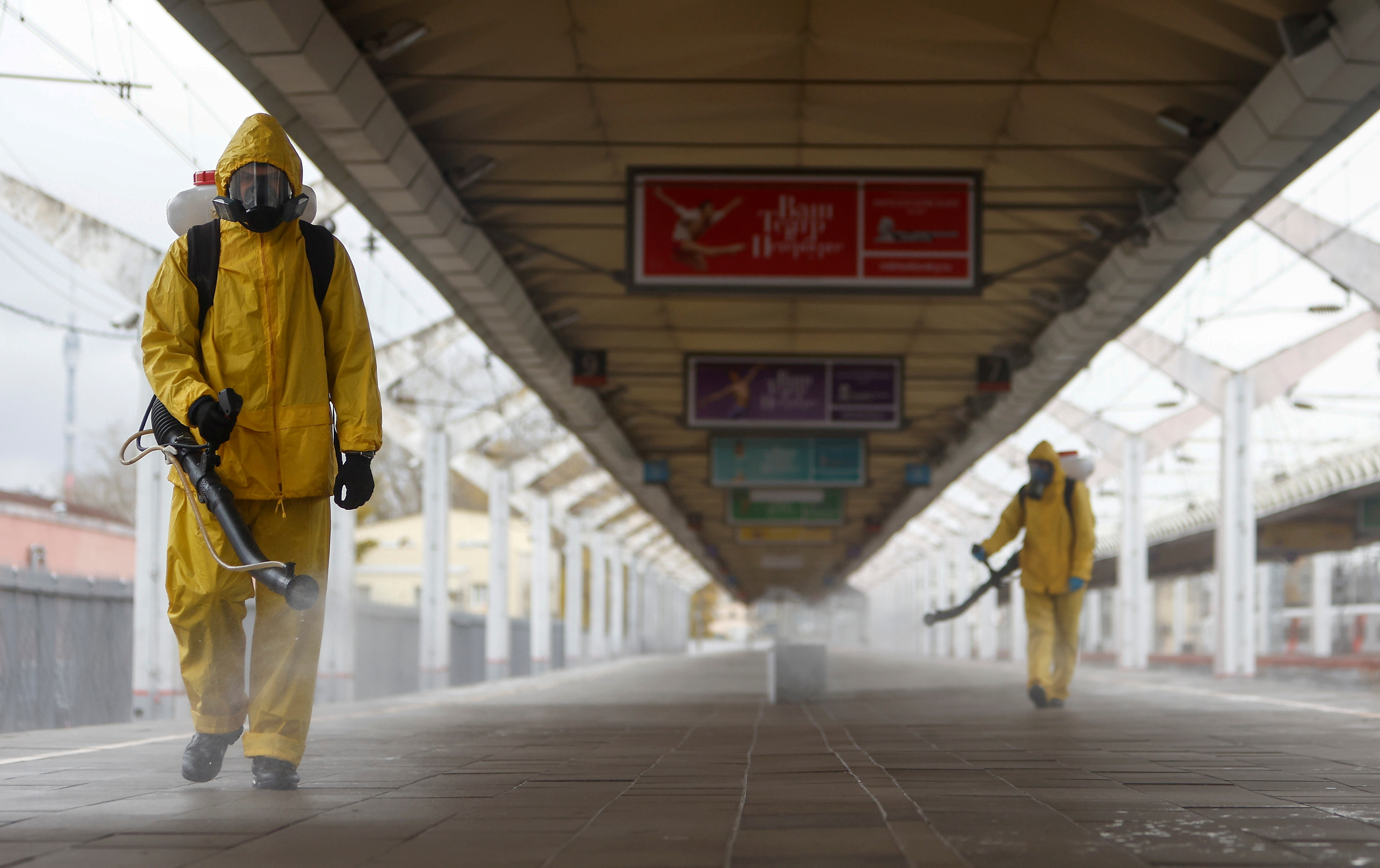 Specialists sanitize a railway station amid the outbreak of the coronavirus disease in Moscow