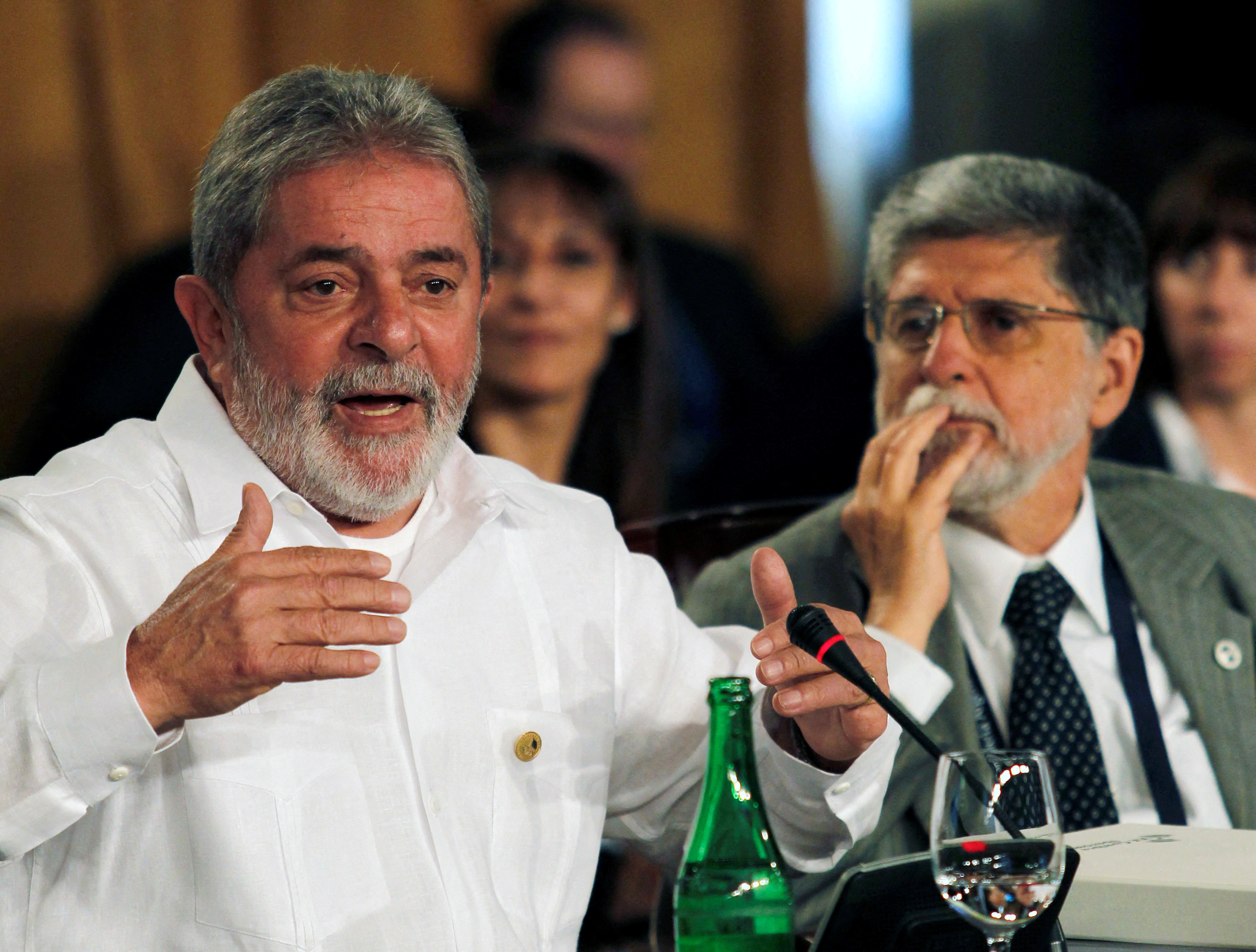 Then-Brazilian President Luiz Inacio Lula da Silva speaks next to his foreign minister, Celso Amorim, at Ibero-American Summit in Mar del Plata