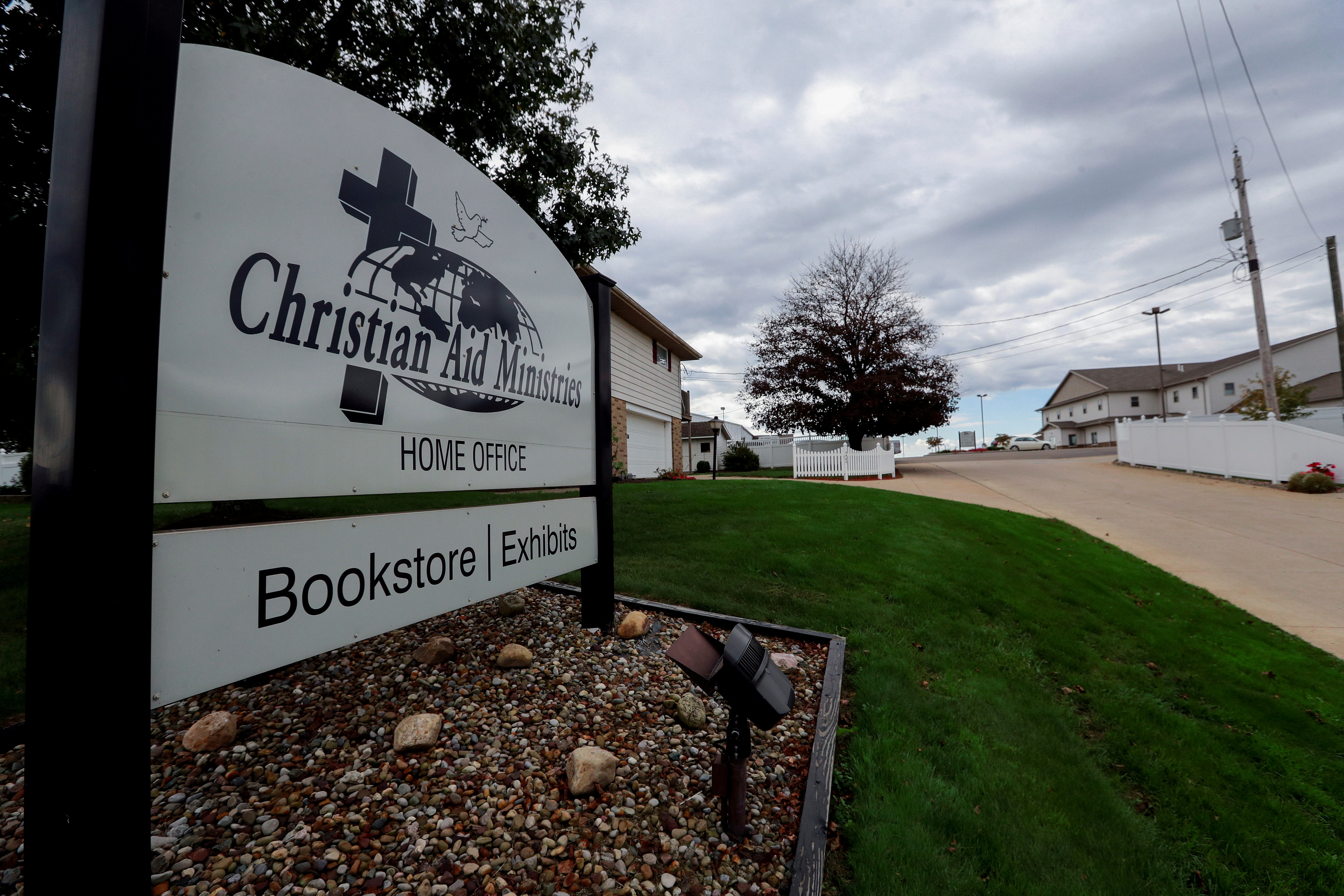 A sign marks the entrance of the home office of Christian Aid Ministries in Millersburg, Ohio, U.S., October 17, 2021. REUTERS/Aaron Josefczyk/File Photo