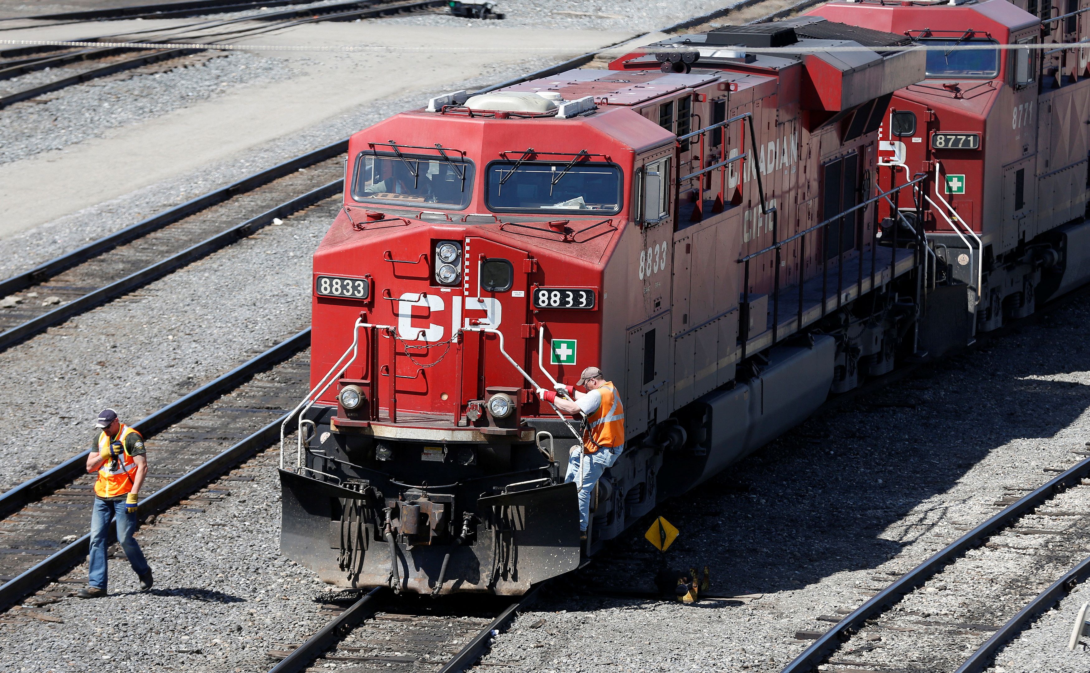 A Canadian Pacific Railway crew works on their train at the CP Rail yards in Calgary