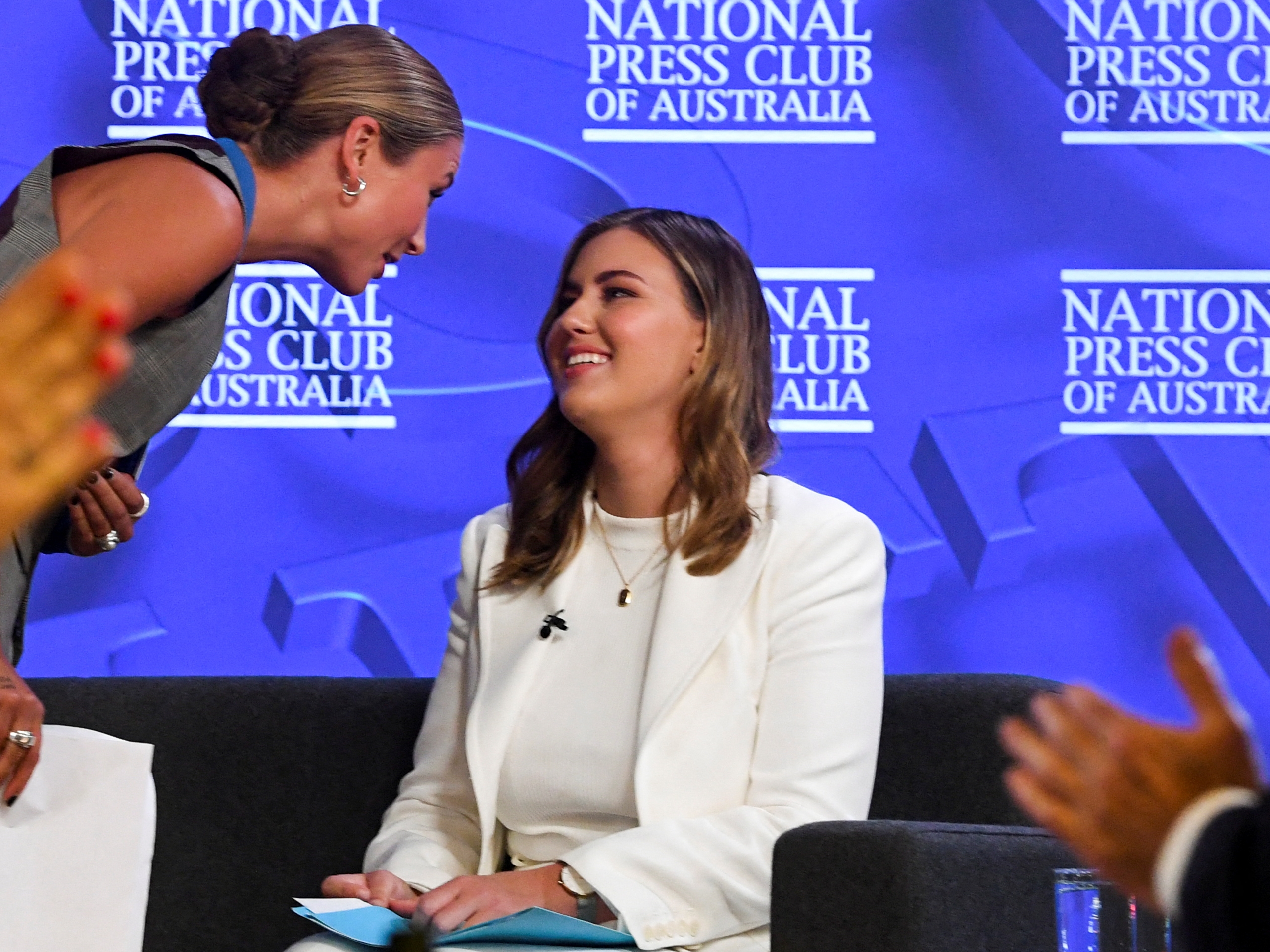 Grace Tame and Brittany Higgins attend the National Press Club in Canberra