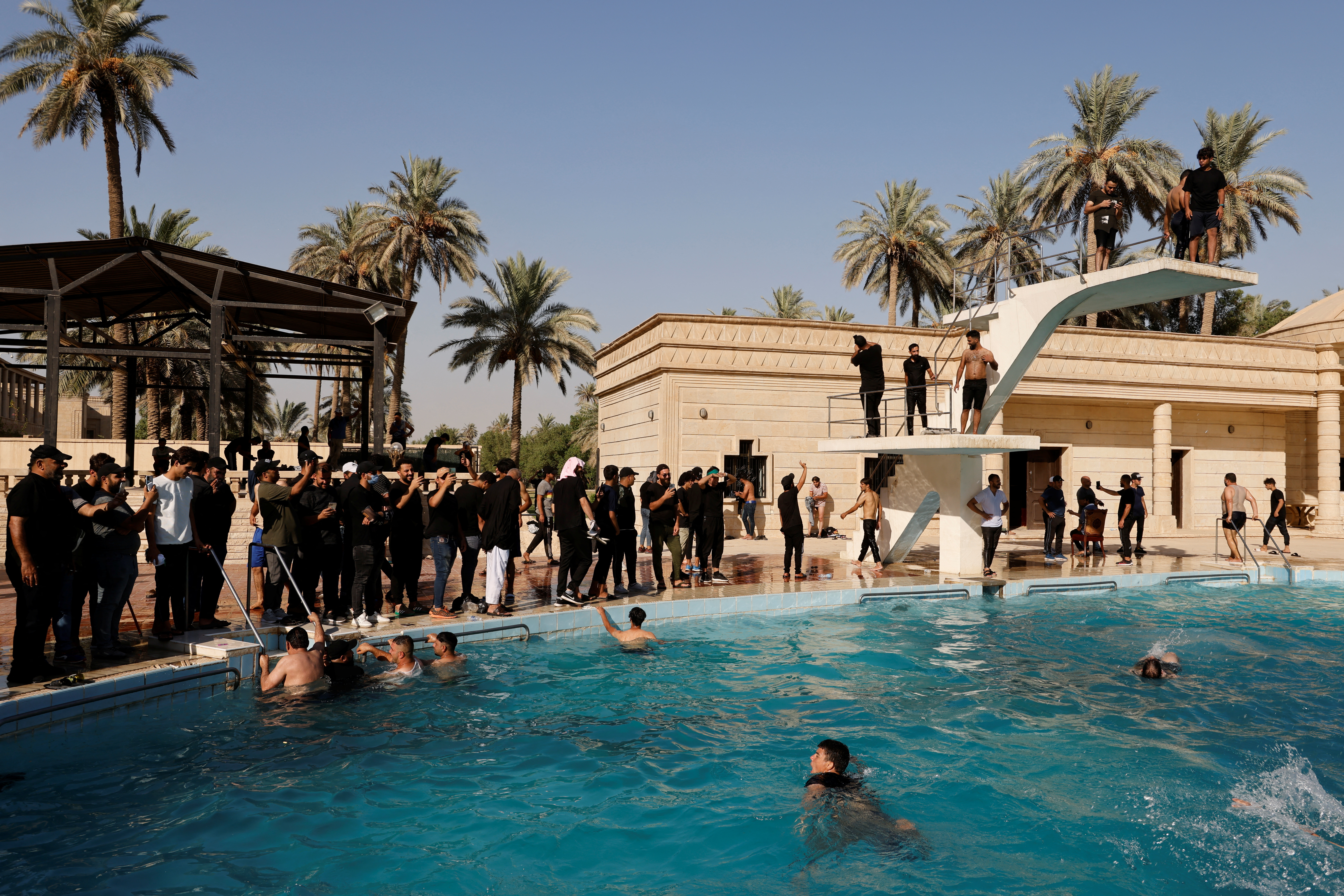 Supporters of Iraqi populist leader Moqtada al-Sadr protest inside the Republican Palace in the Green Zone, in Baghdad