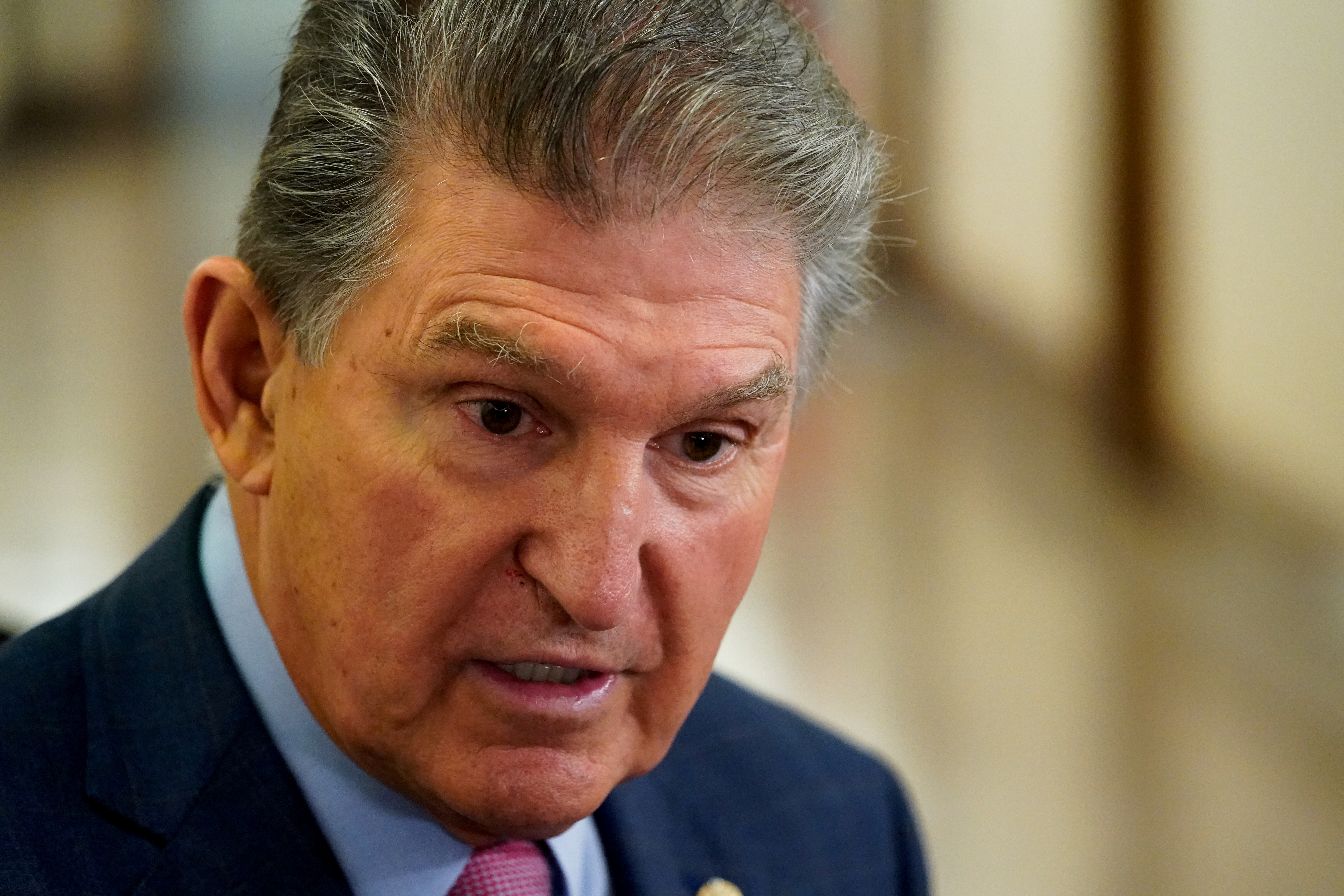 U.S. Senator Joe Manchin (D-WV) talks to reporters before the start of a Senate Energy and Natural Resources Committee hearing on Capitol Hill in Washington