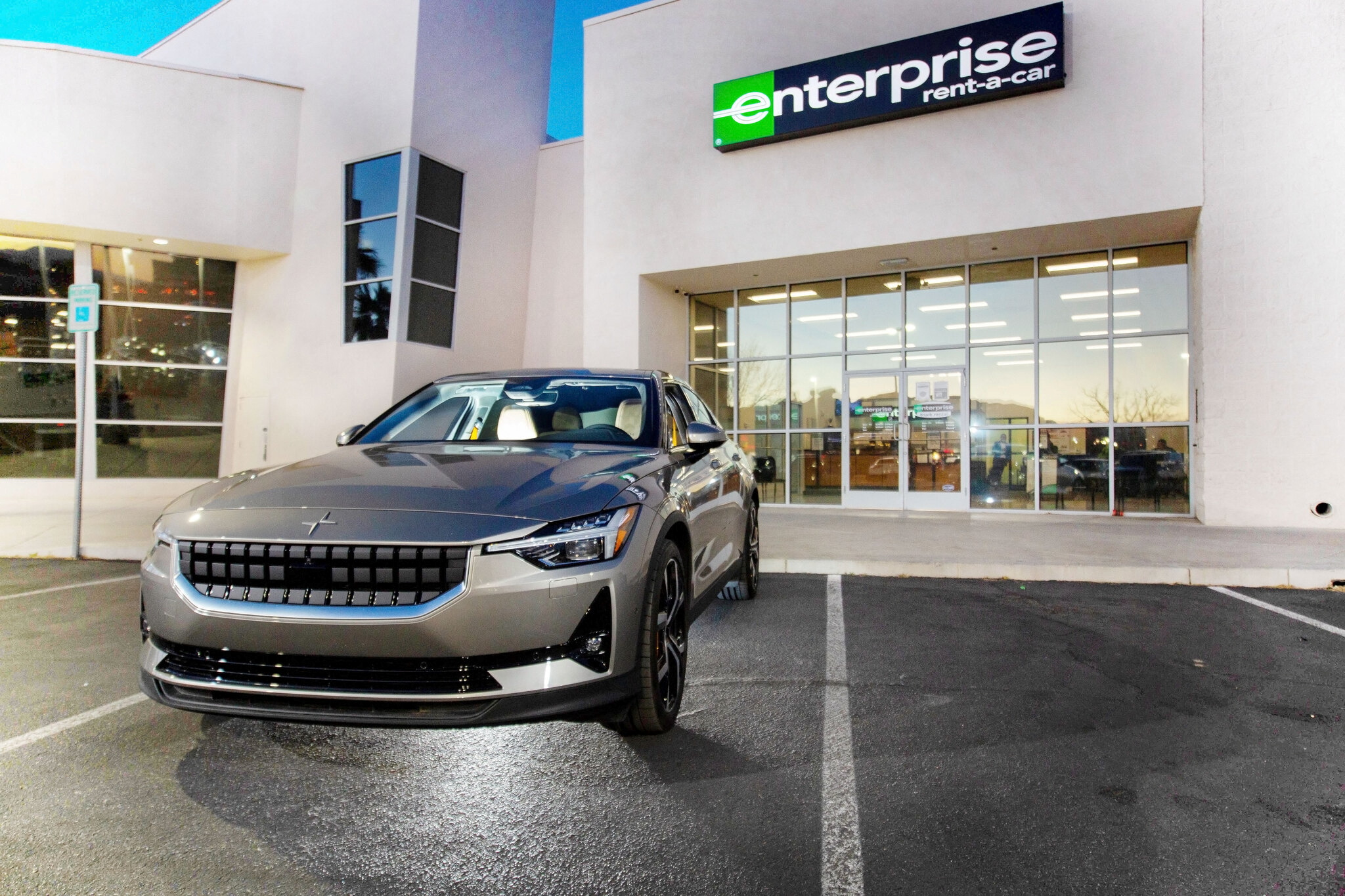 An electric vehicle by manufacturer Polestar is seen in front of an Enterprise Rent-A-Car location, in Las Vegas